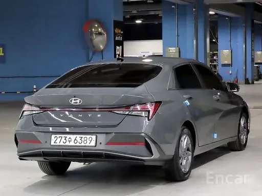 Gray Hyundai Ioniq electric car parked inside a garage or showroom.