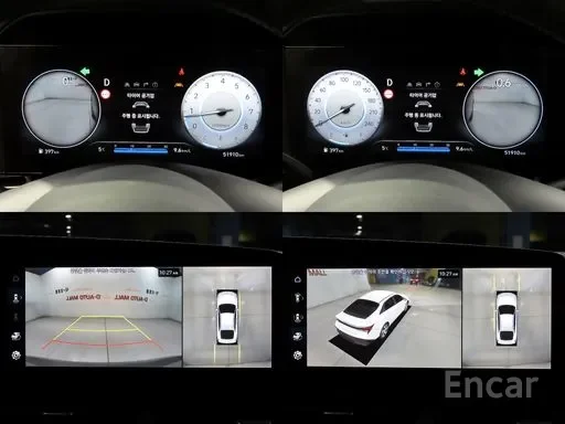 Car dashboard with instrument cluster and rearview camera display showing parking view with guide lines.