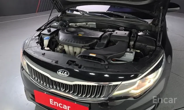 Front view of a black Kia car with its hood open, showing the engine compartment and headlights.