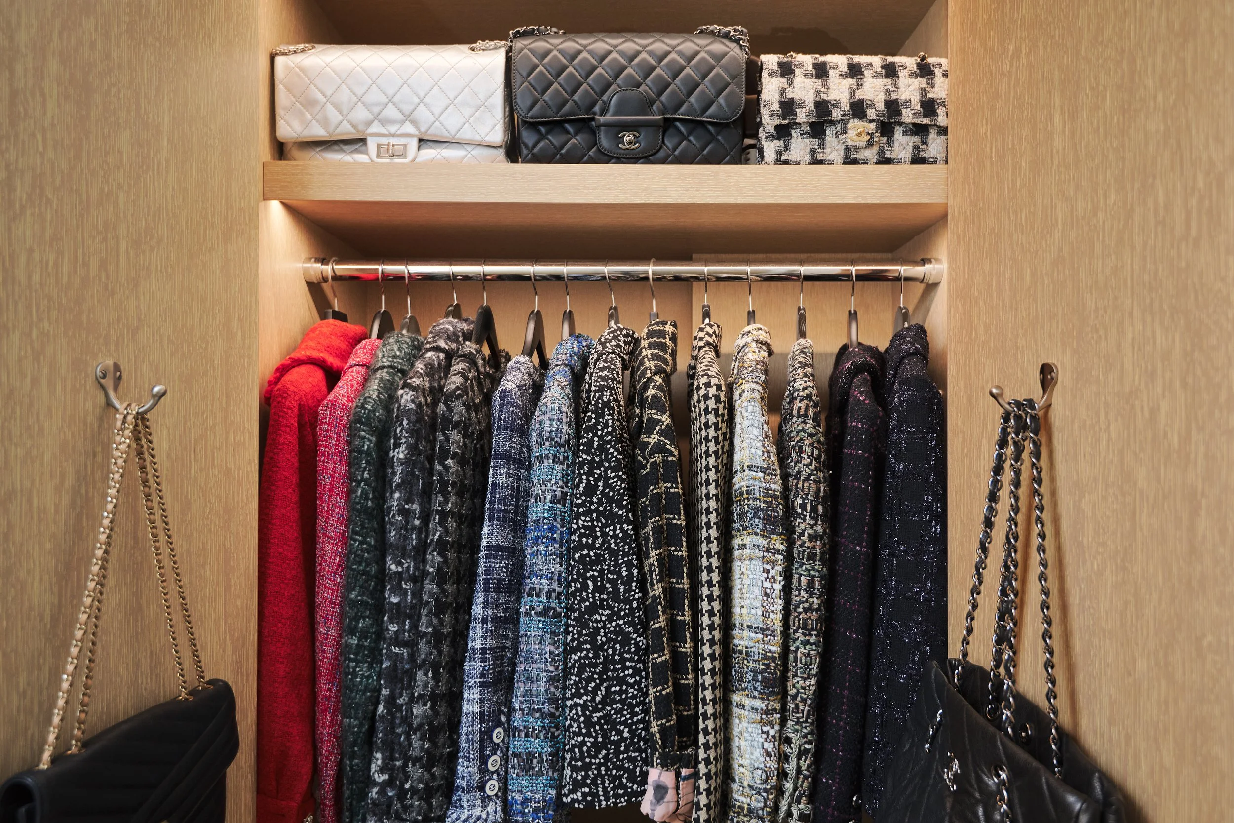 Chanel Items in a coat closet. Designer luxury bags and Jackets.