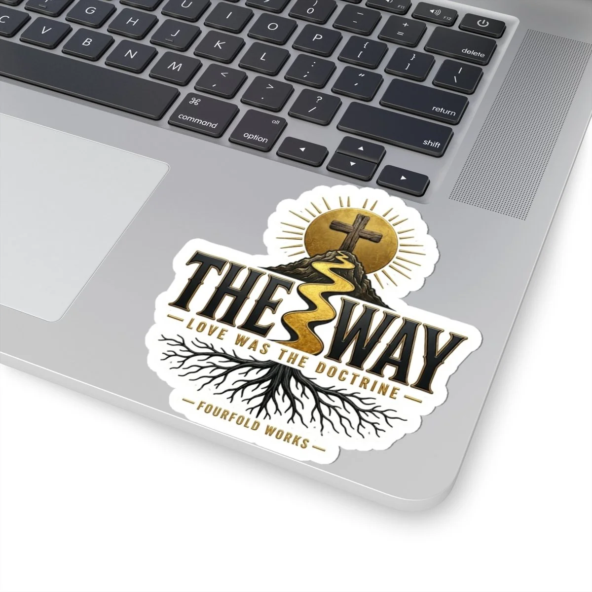 The Way cross-and-path faith sticker applied to a laptop palm rest.