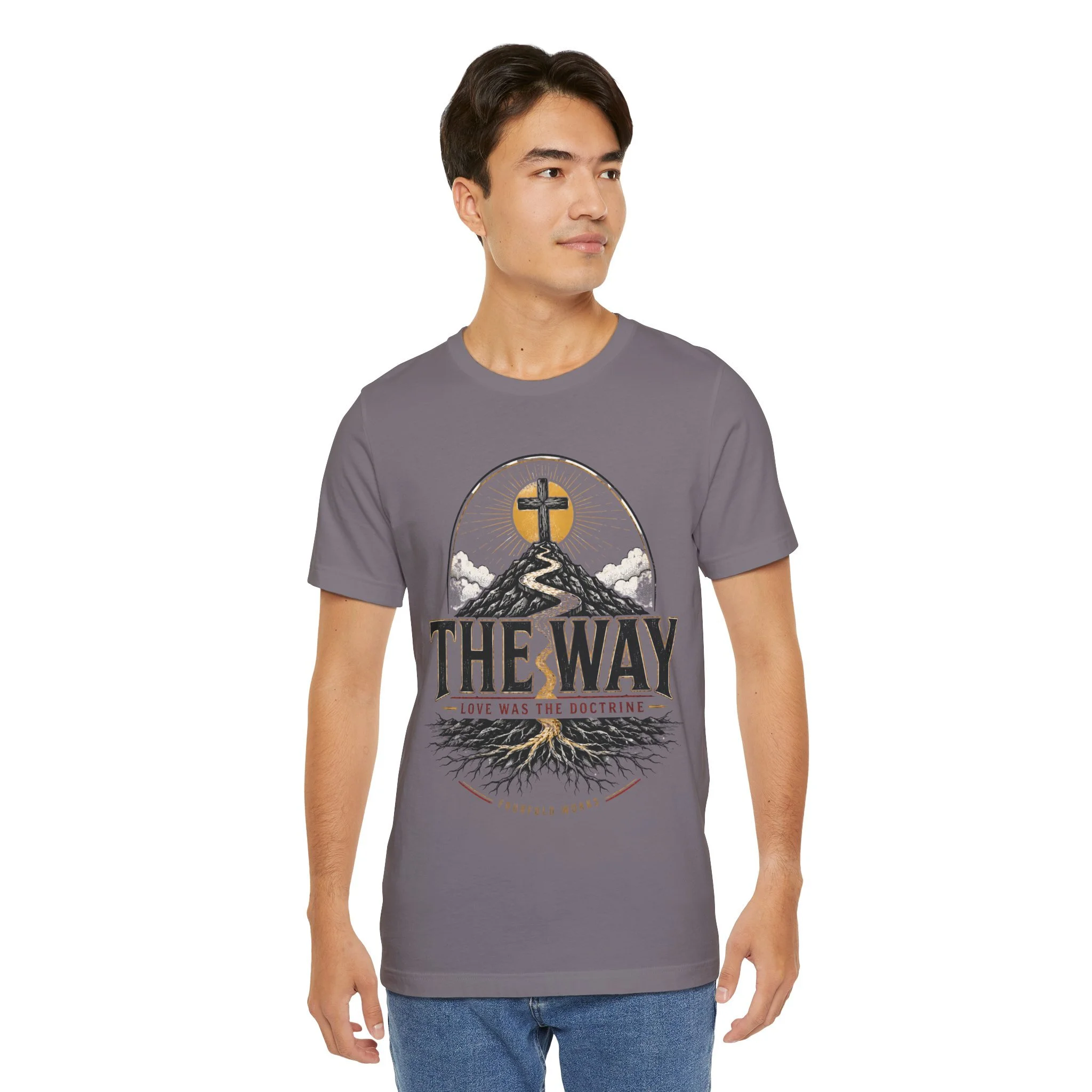 Model wearing the charcoal The Way faith T-shirt with cross-and-path artwork and The Way lettering.