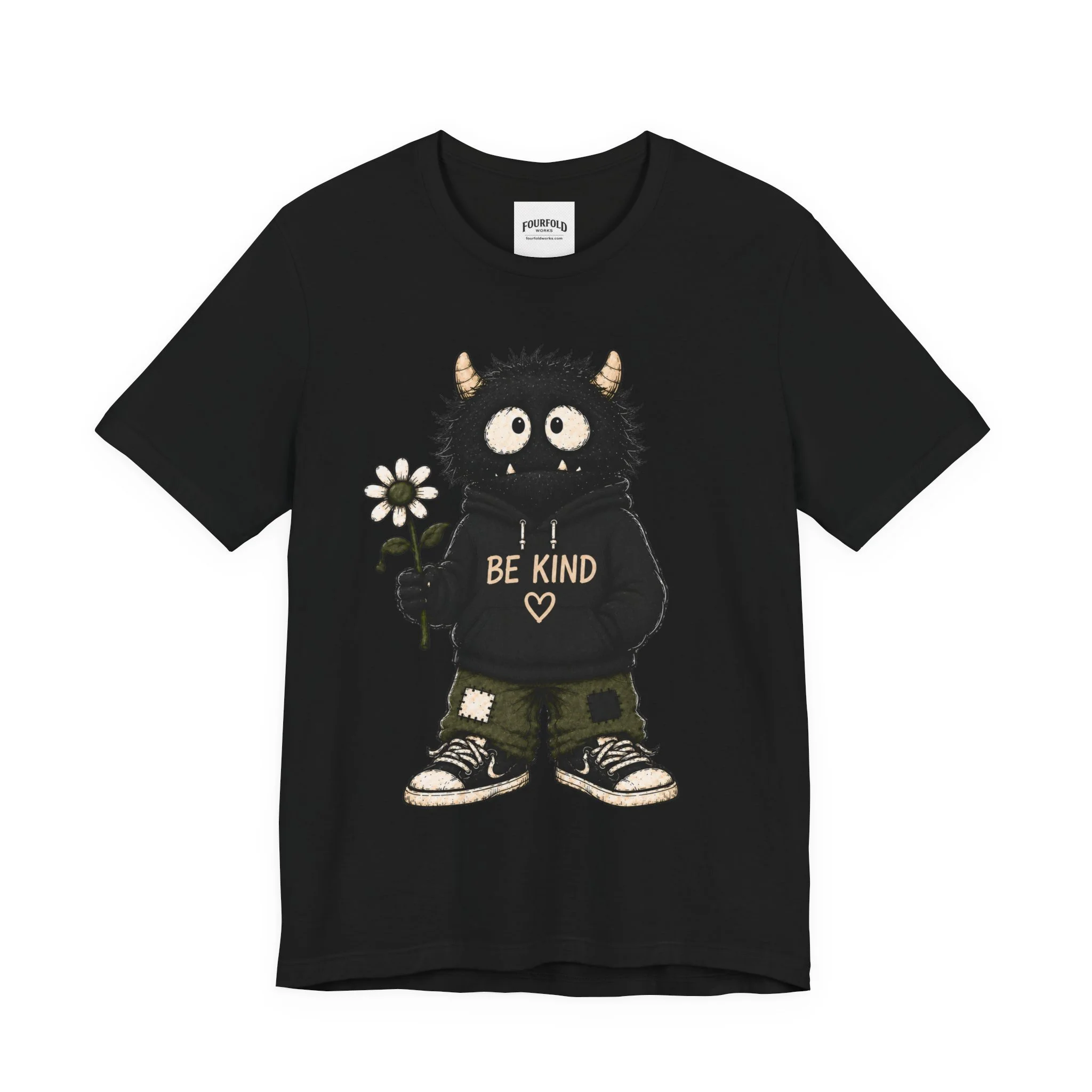 Front of the black Be Kind T-shirt with the full monster character graphic.