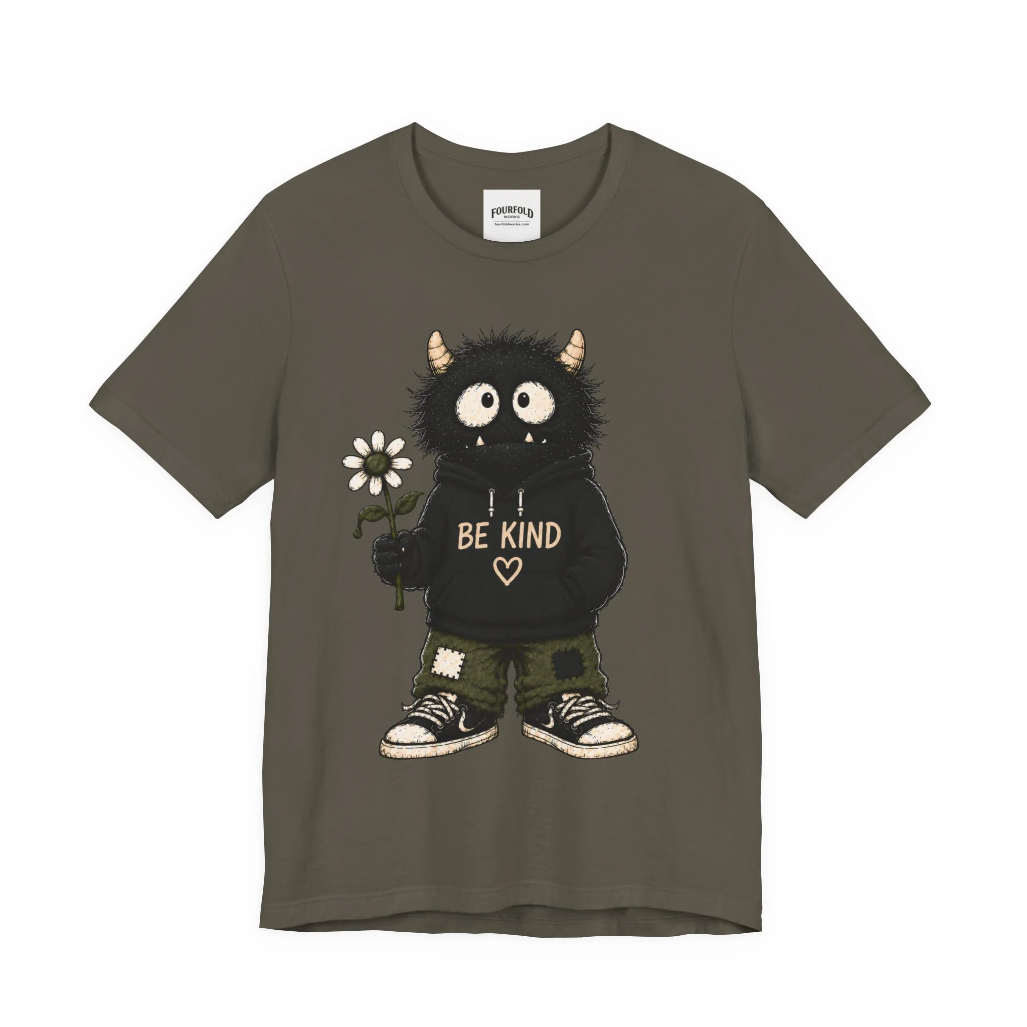 Front of the olive-colored Be Kind T-shirt with the full monster character graphic.