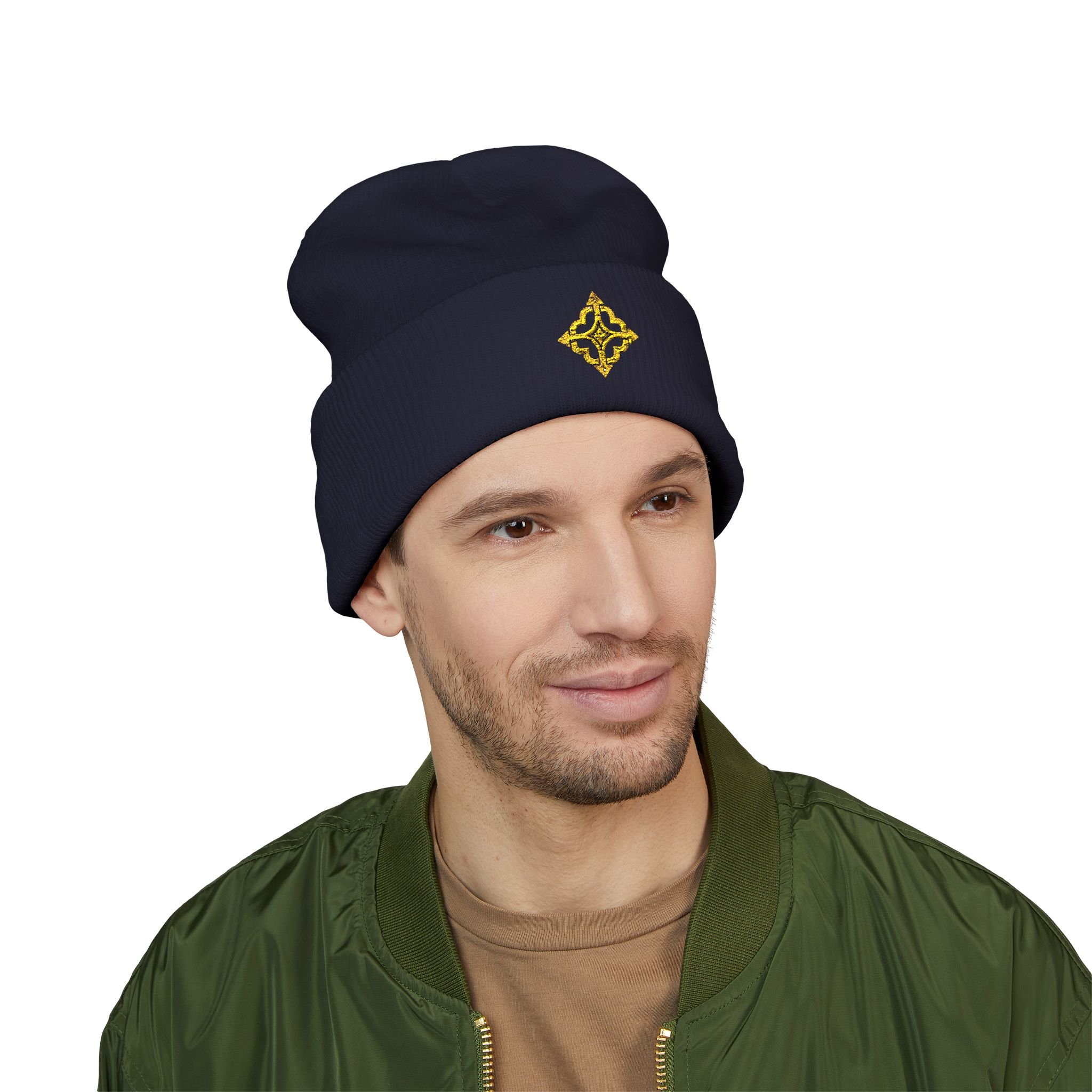 Second model wearing the navy Quiet Compass beanie, showing the embroidered front cuff.