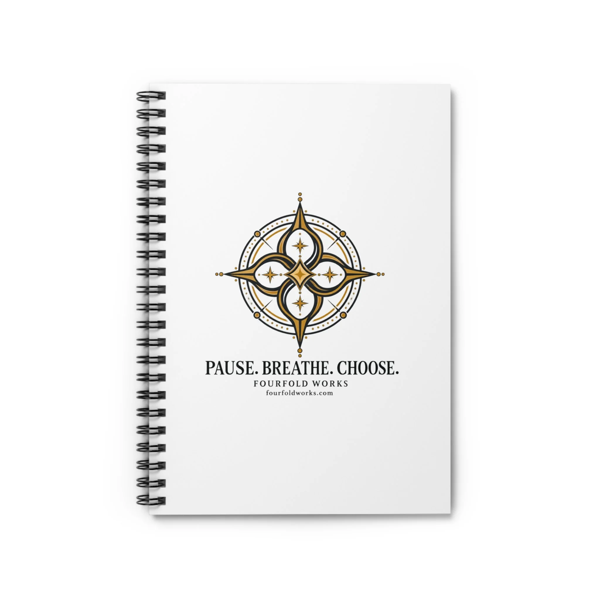 Front cover of the Fourfold Practice spiral notebook with gold compass artwork and Pause. Breathe. Choose. lettering.