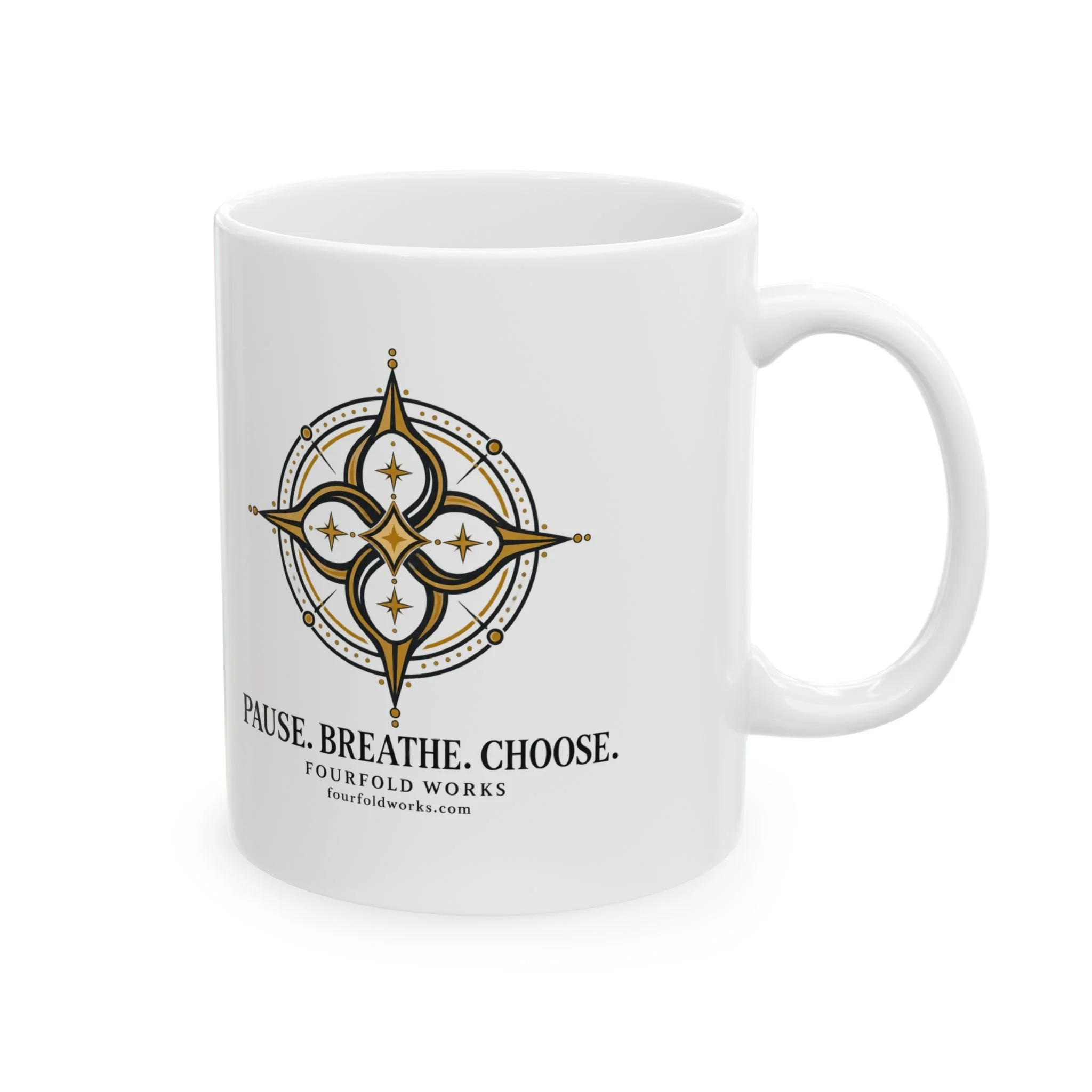 White Pause. Breathe. Choose. ceramic mug with gold compass artwork and its C-shaped handle on the right.