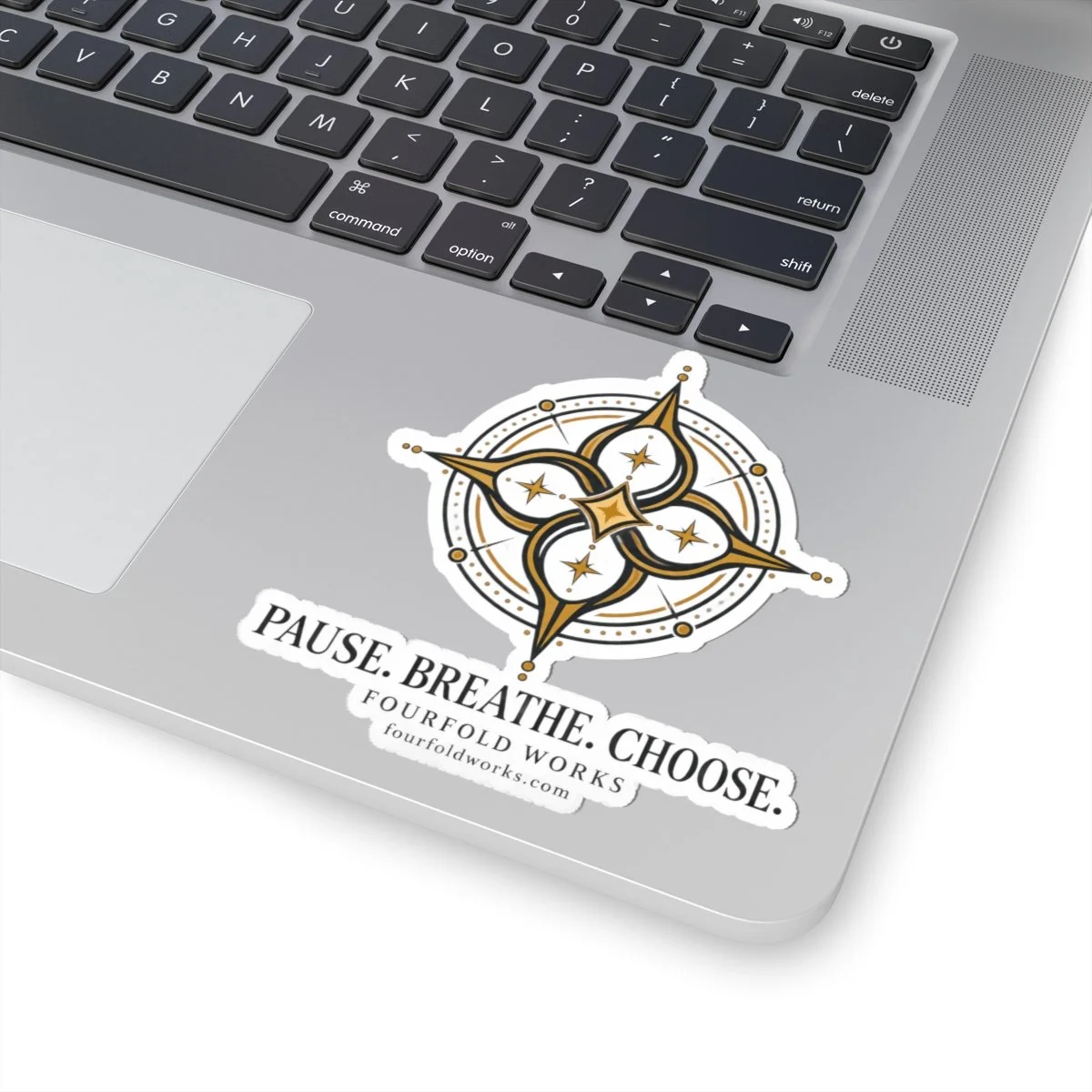 Pause. Breathe. Choose. compass sticker applied to a laptop palm rest.