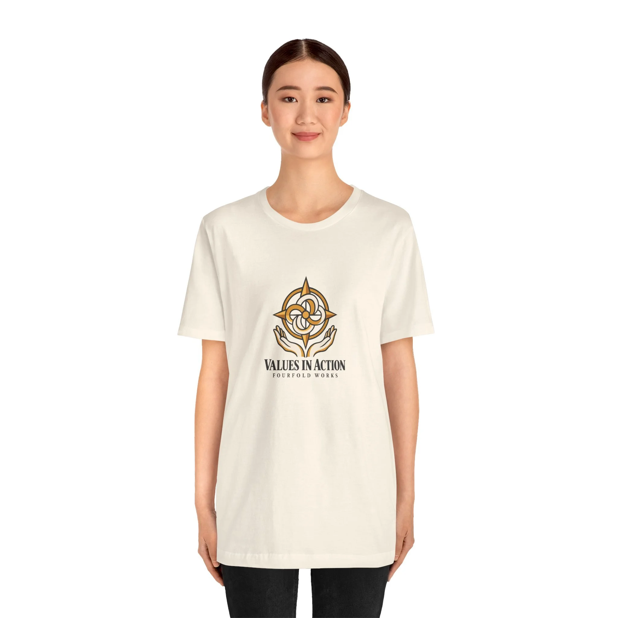 Model wearing the natural-colored Values in Action Fourfold Works T-shirt, shown from the front.