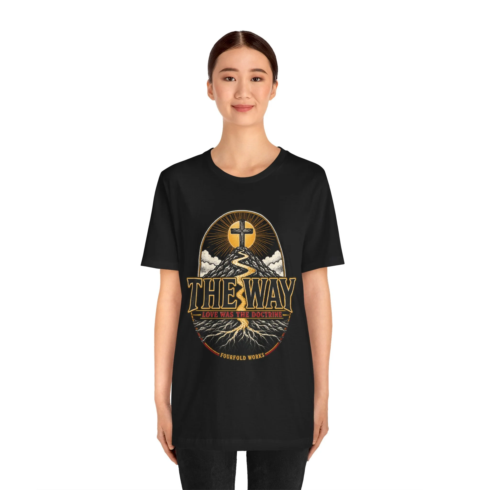 Black The Way T-shirt modeled from the front, showing the approved V2 crest, cross and corrected roots with complete wording.
