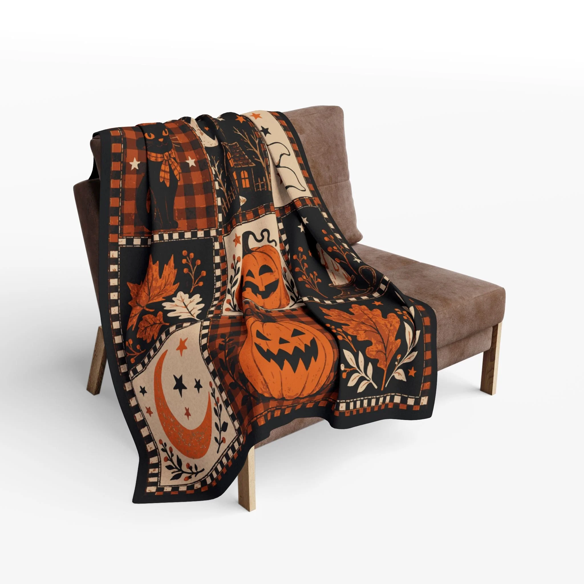Vintage Halloween Patchwork fleece blanket draped over a chair with its Halloween panels visible.