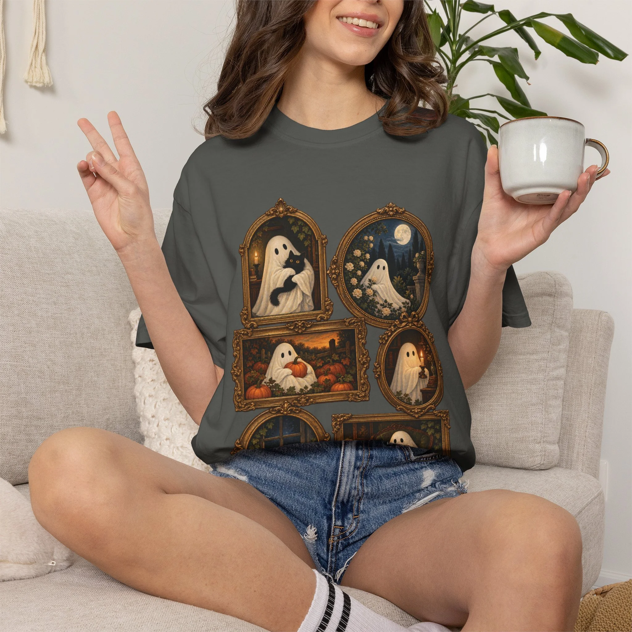 Seated model wearing Pepper Vintage Ghost Gallery tee, front view
