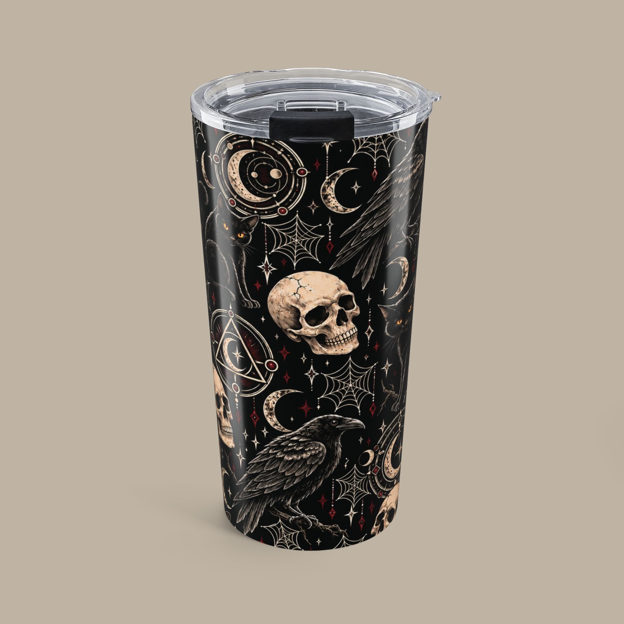 Front of the Gothic Magic 20oz tumbler with ivory skulls, ravens, crescent moons and oxblood accents on a dark wrap.