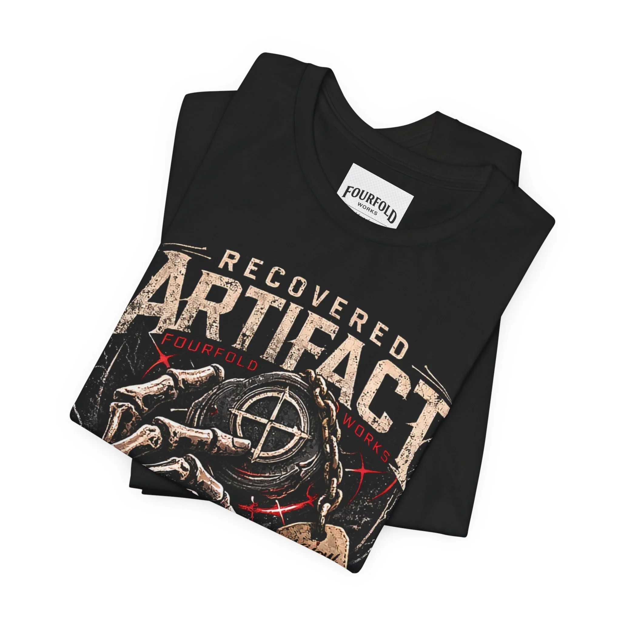 Folded Black Recovered Artifact T-shirt showing part of the vintage skeleton and compass design.