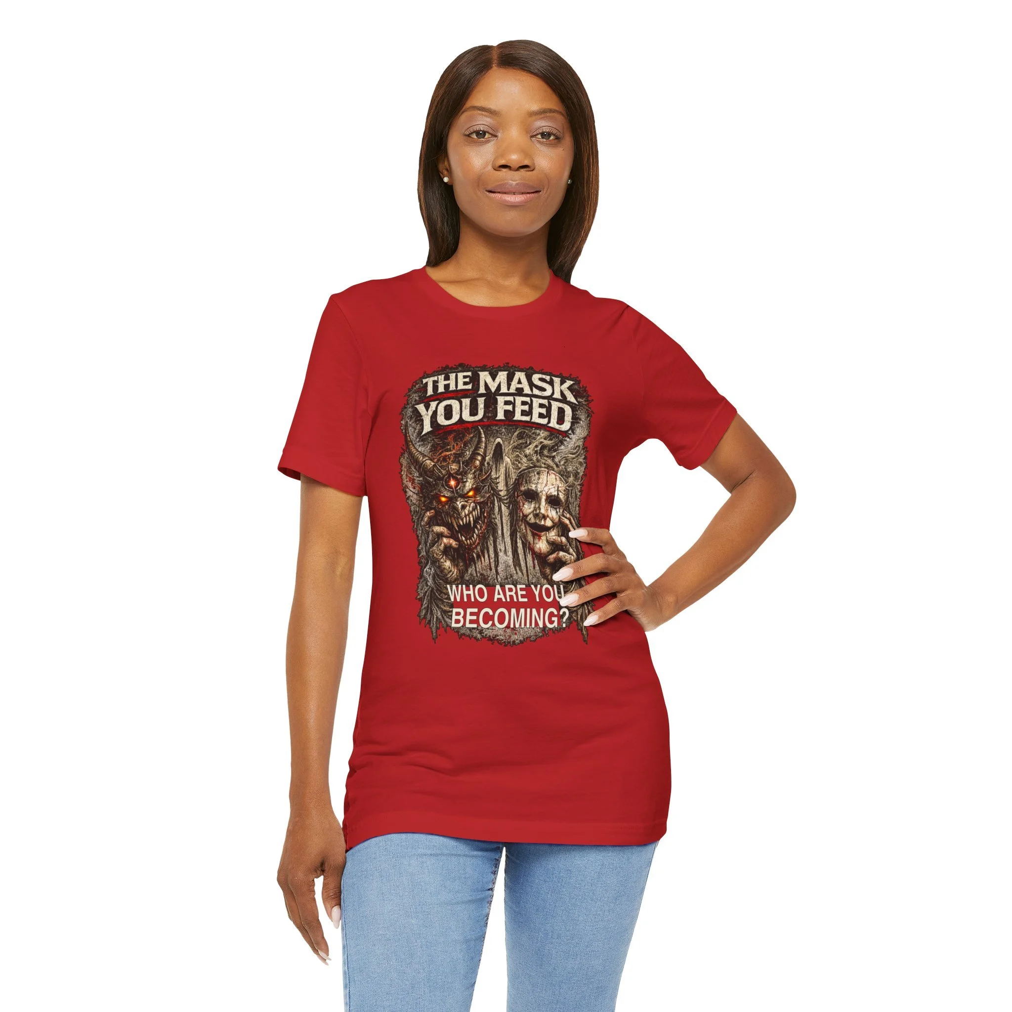 Person wearing the Red The Mask You Feed T-shirt; the lower hem is tucked into the trousers.
