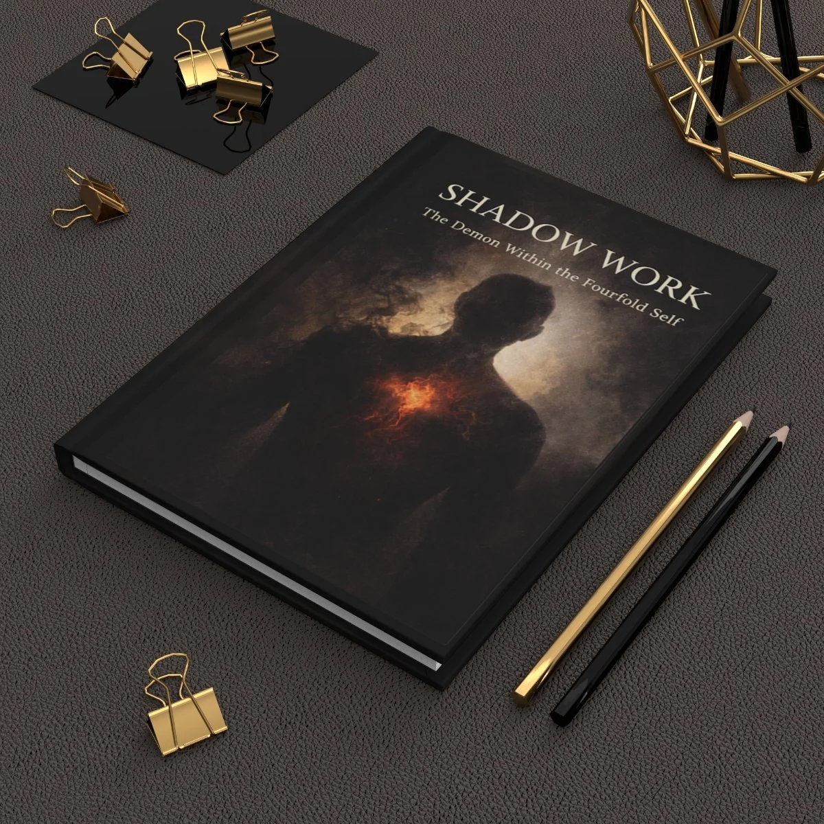 Shadow Work The Demon Within lined journal on a charcoal desk with gold stationery.