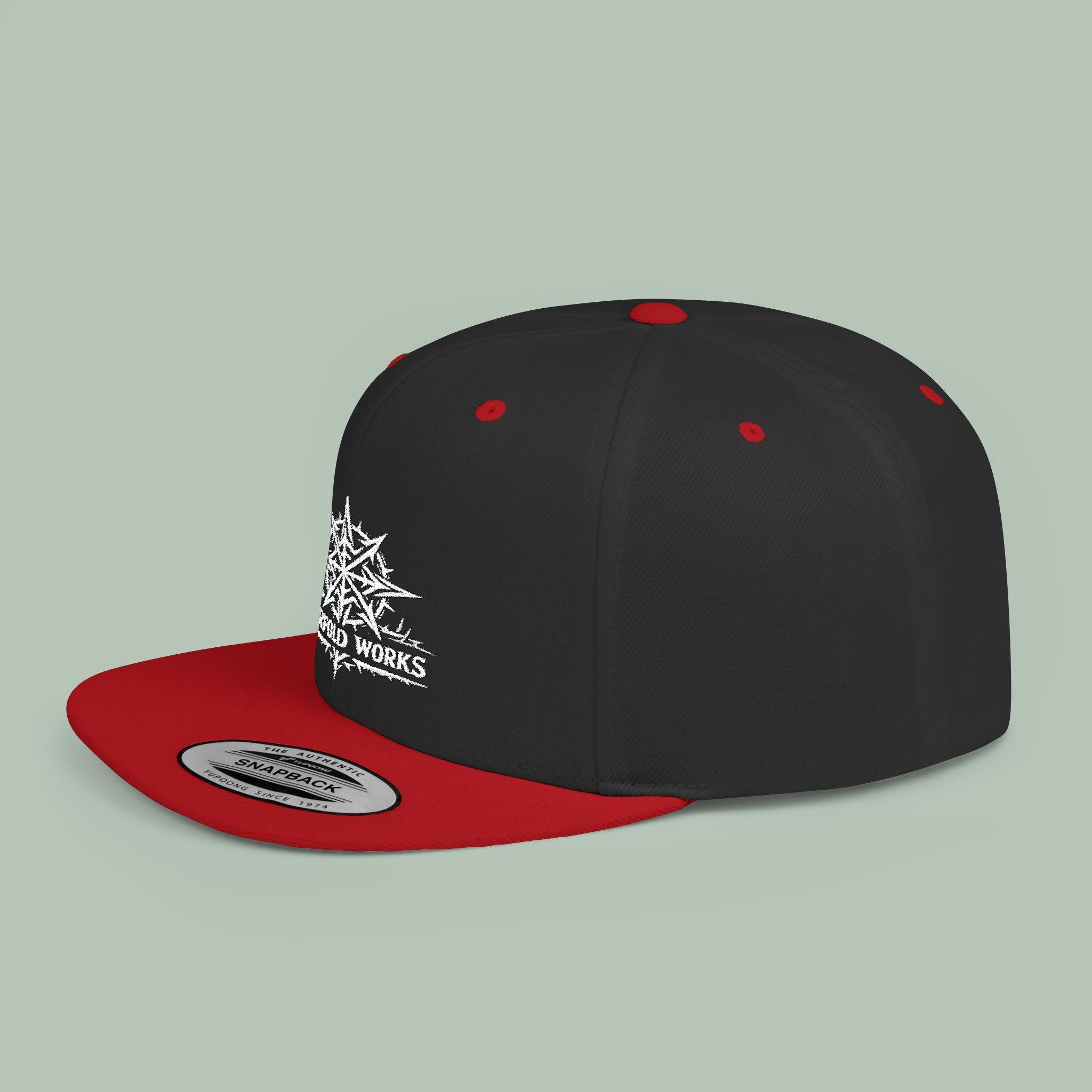 Black/Red Yupoong 6089M Fourfold Works Compass snapback, side view on sage with the complete approved embroidery, red bill, button and eyelets.