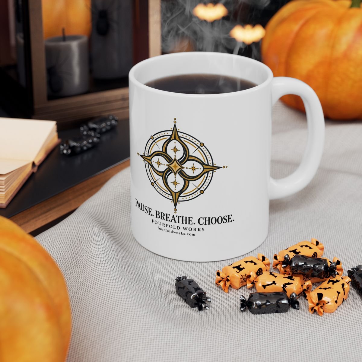White 11 oz Pause. Breathe. Choose. compass mug with steam in an autumn scene with pumpkins, books, and candy.
