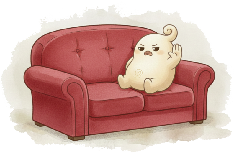 Pudding sitting on a red sofa, symbolic mascot of Aurora Fern Oracle
