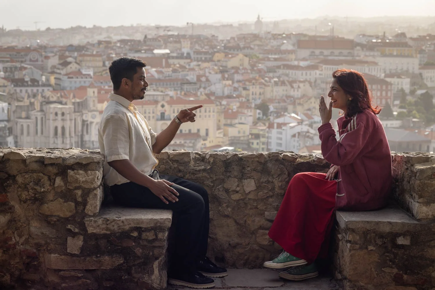 Couple , having fun after a surprise proposal photoshoot at the Lisbon Castle, during the sunset.