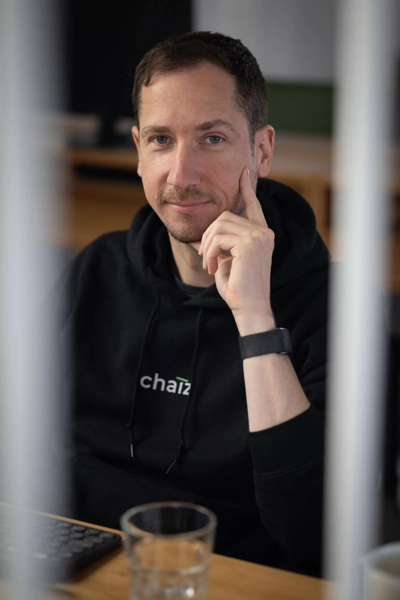 Startup offsite photography at the Lisbon coworking place, portrait of  man at the desk.
