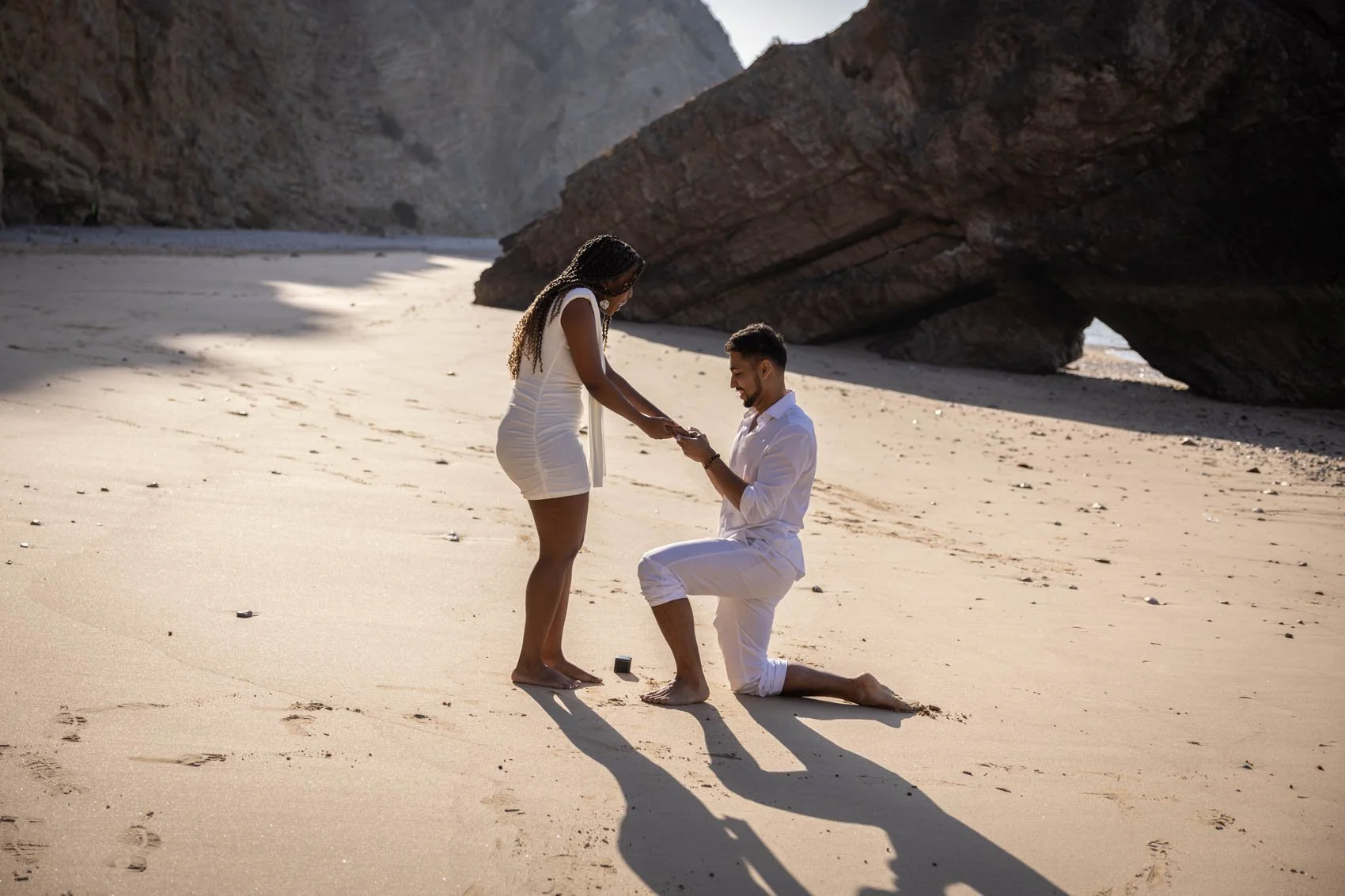 Magical sunrise secret proposal photoshoot with a beautiful couple from UK at Ribeira de Cavalo beach in Sesimbra.