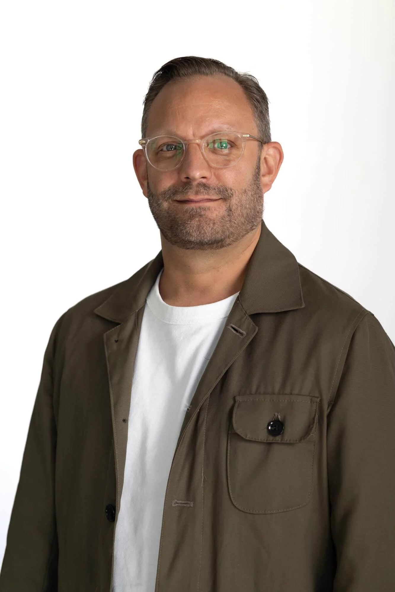 Headshot of the startup CEO n front of a white background.