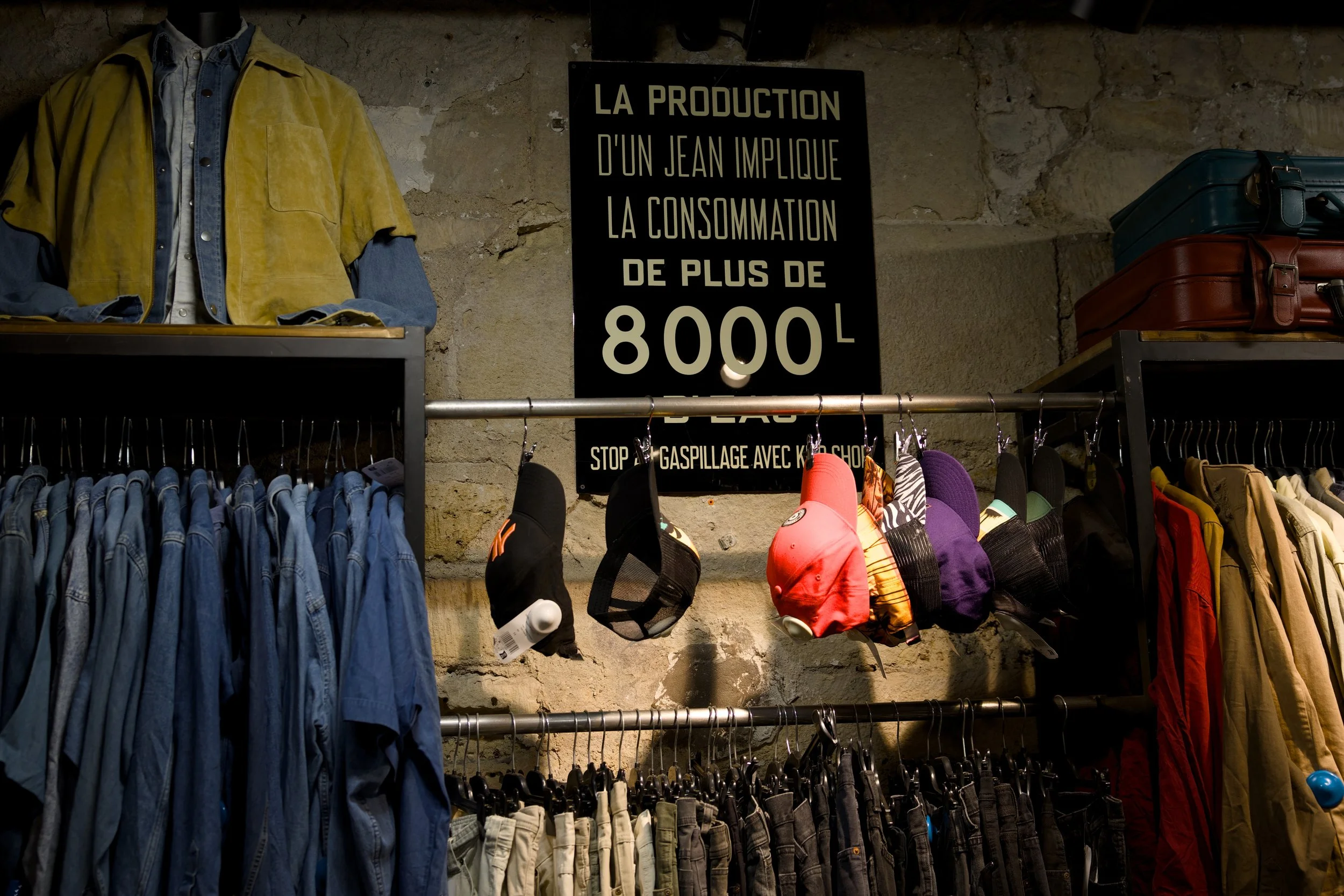 Interior photography of Kilo Shop in Paris – exposed brick walls and vintage leather suitcases