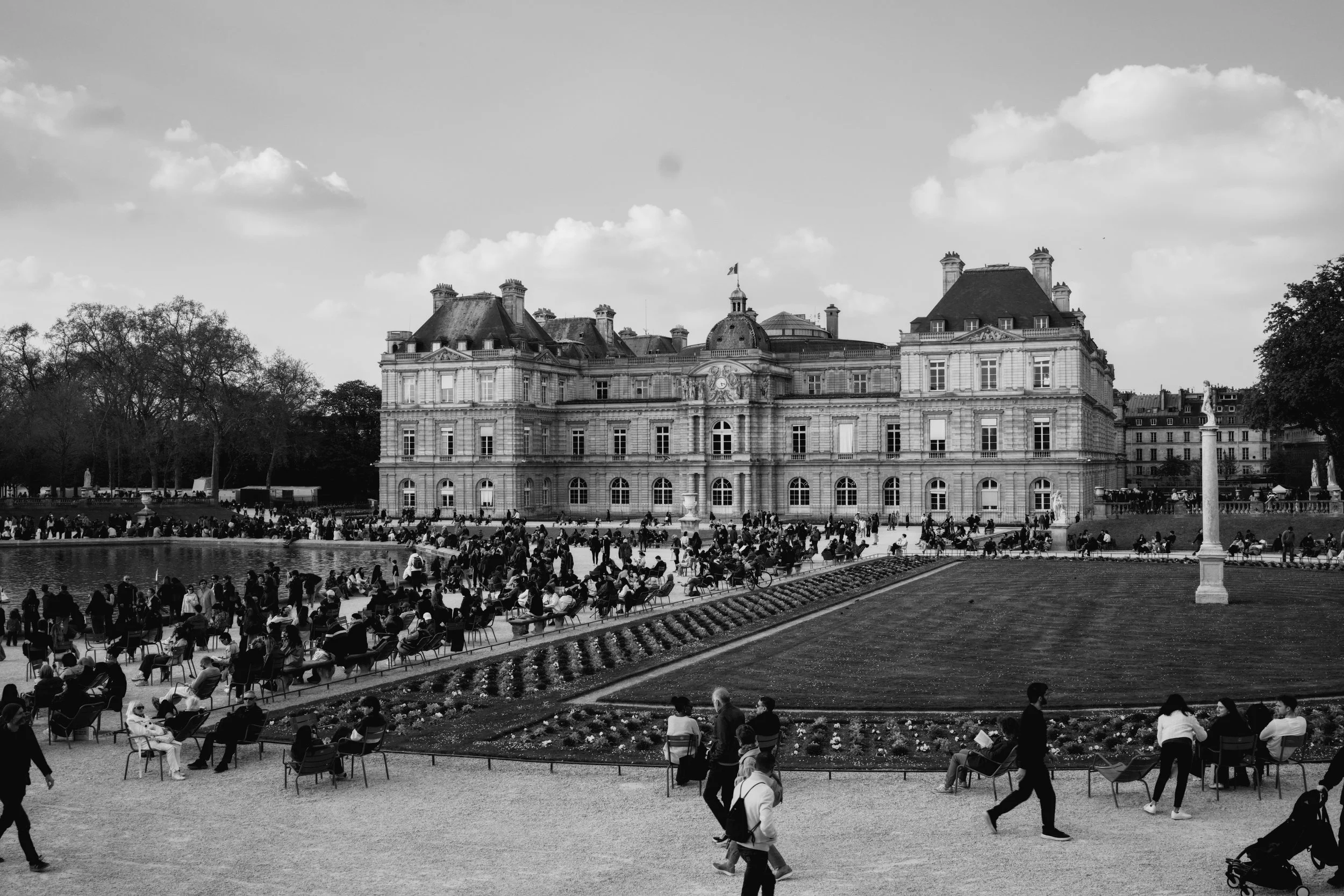 Panoramic view of Jardin du Luxembourg in Paris with historic building in the background
