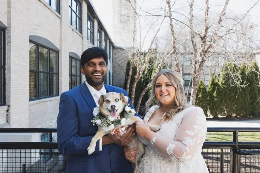 Bride and Groom Holding pet