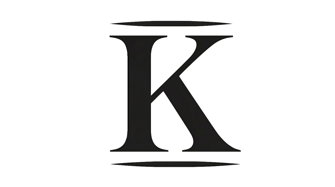 Close-up of a black letter 'K' on a grey background.