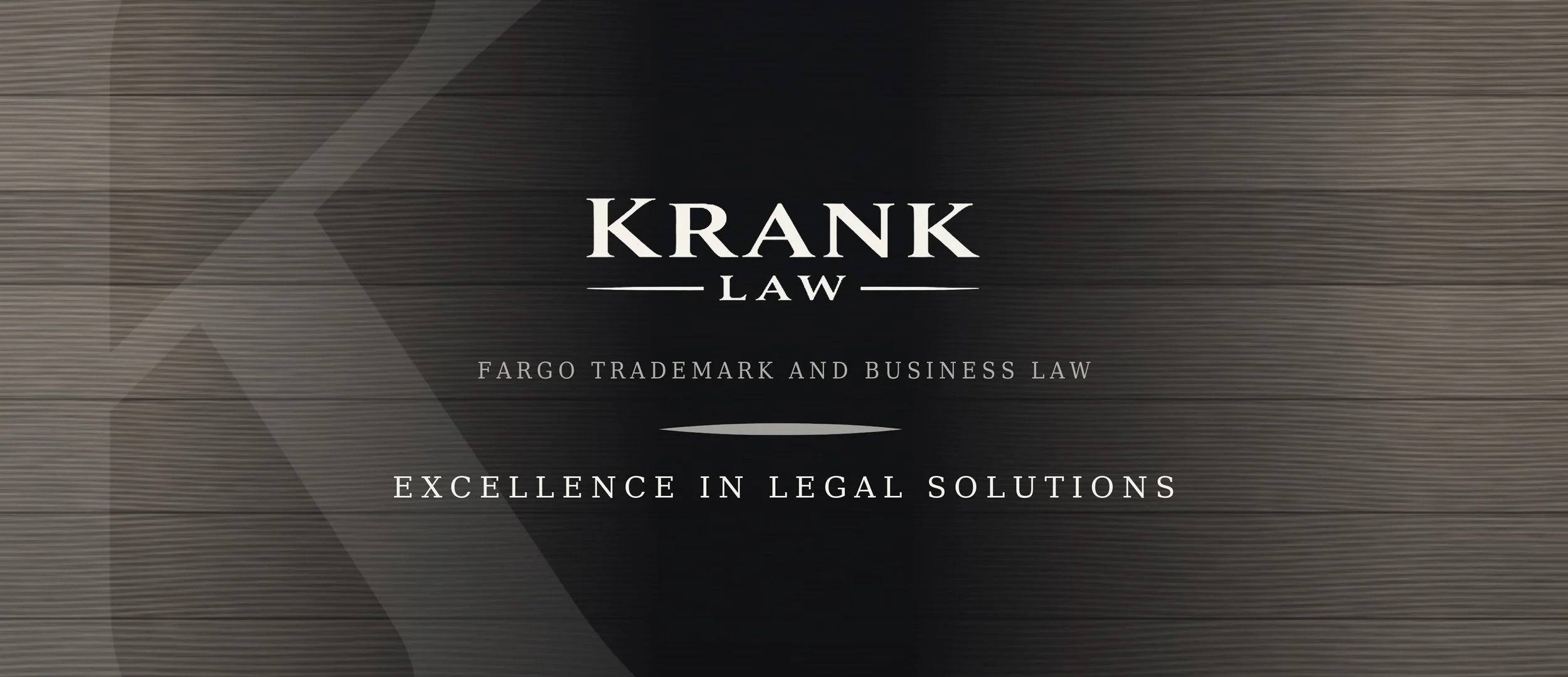 A professional logo for Krank Law with text indicating specialization in Fargo trademark and business law, emphasizing excellence in legal solutions.