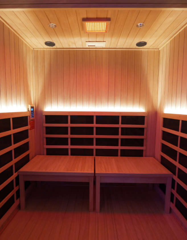 Private infrared sauna suite with red light therapy at Kontra Baths Nassau County