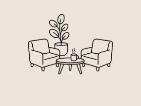 Minimalist living room with two armchairs, a small coffee table with a cup of coffee, and a potted plant in the background.