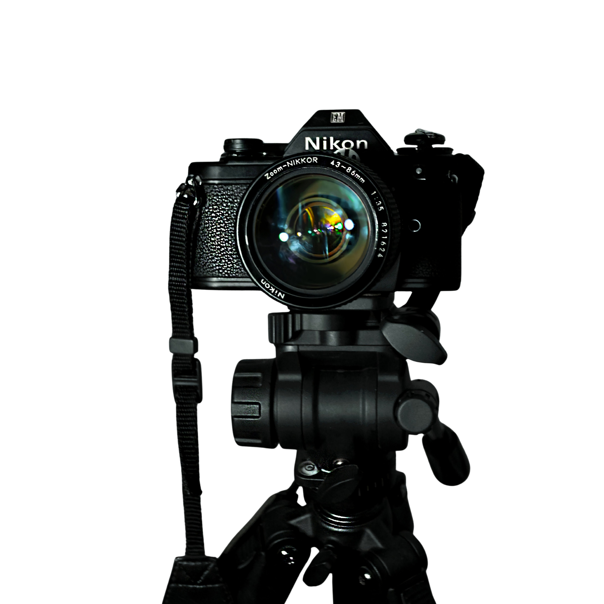 A professional Nikon camera mounted on a tripod against a black background.