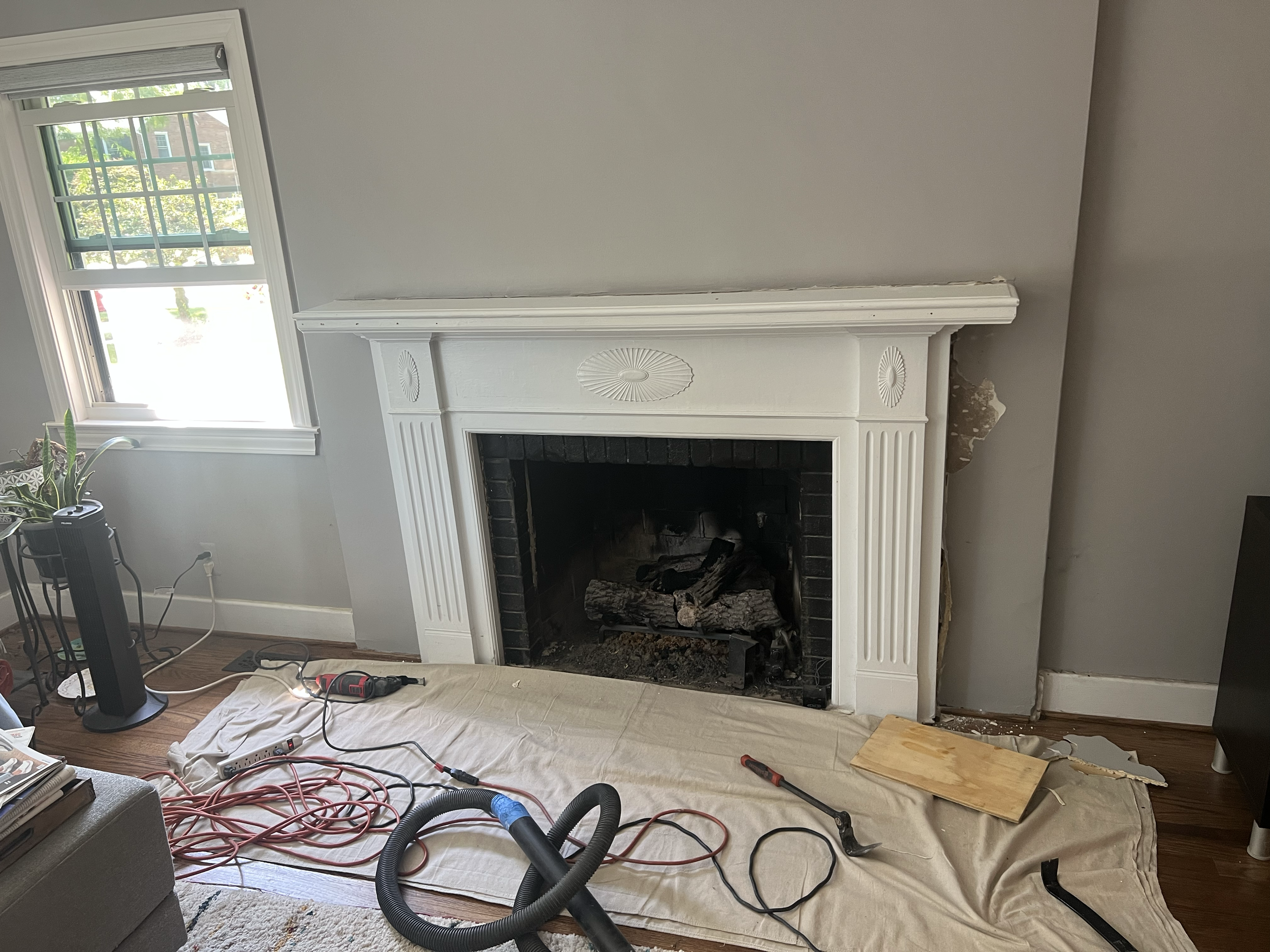 BEFORE - This mantle was original to the home but the home owner had no emotional attachment to it. They wanted something more functional and reflective of their personality.