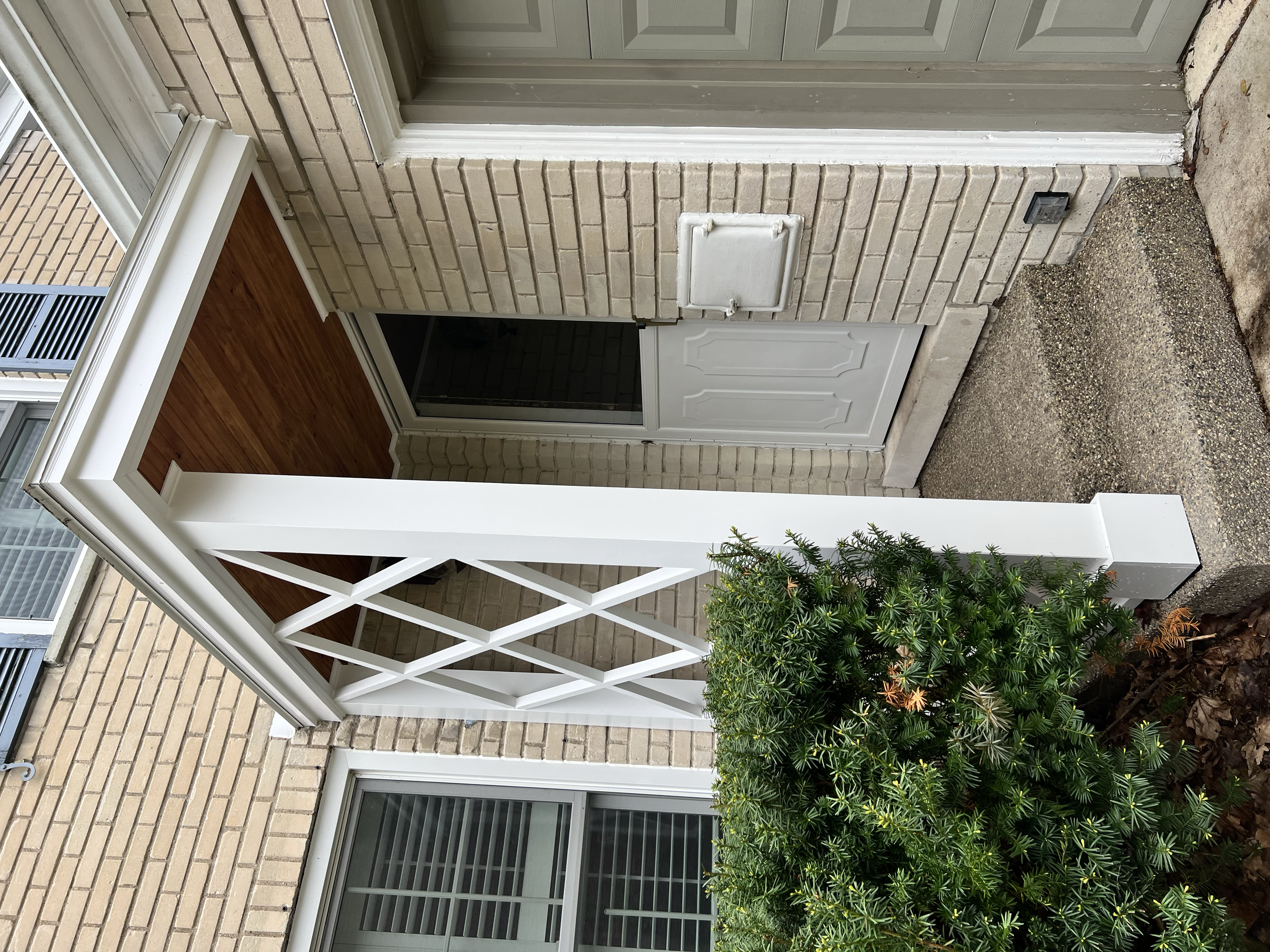 AFTER - The portico was completely rebuilt, featuring a stained, bead board ceiling and fully restored lattice screen. The structure was also given a new rubber roof and flashing.