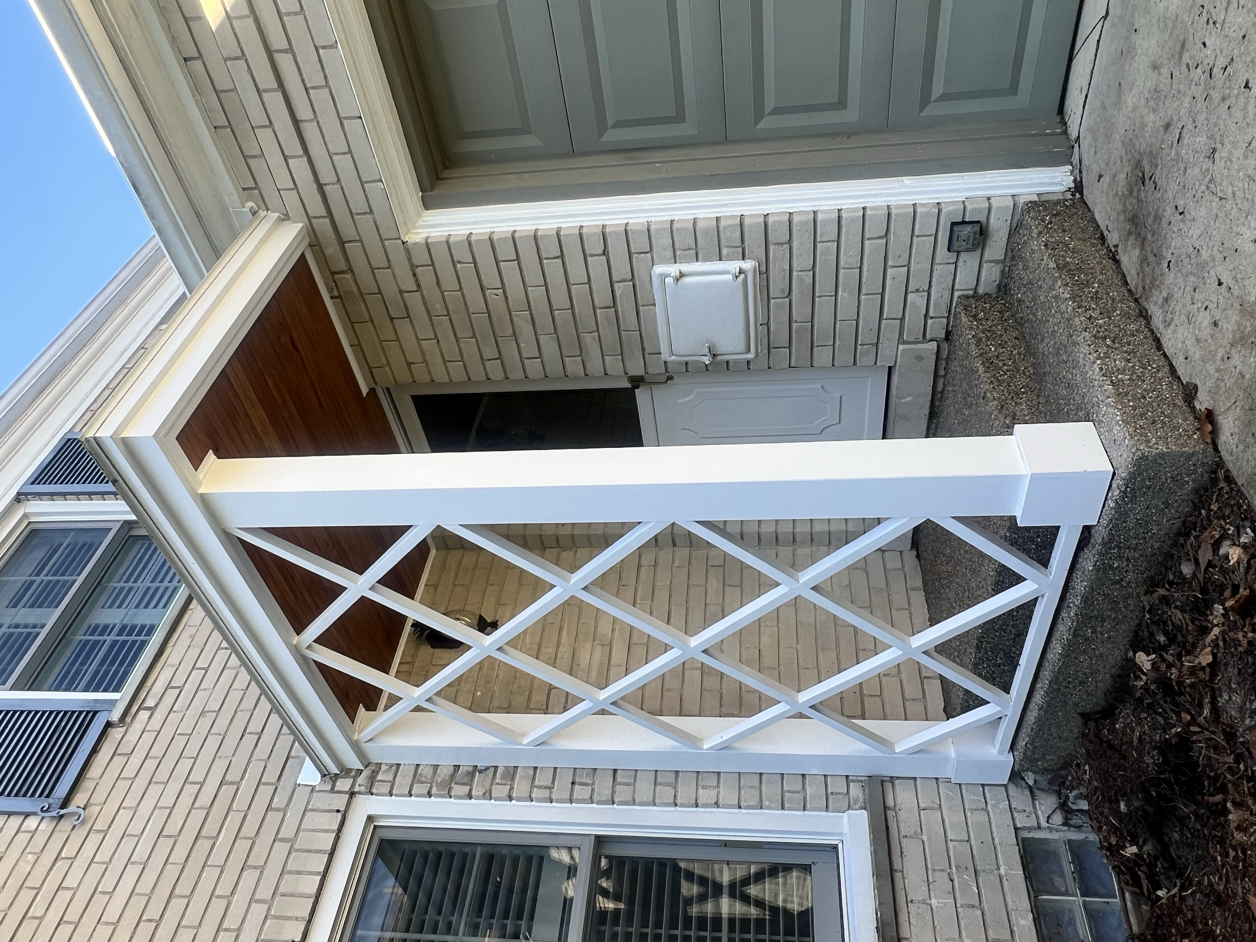 AFTER - The portico was completely rebuilt, featuring a stained, bead board ceiling and fully restored lattice screen. The structure was also given a new rubber roof and flashing.