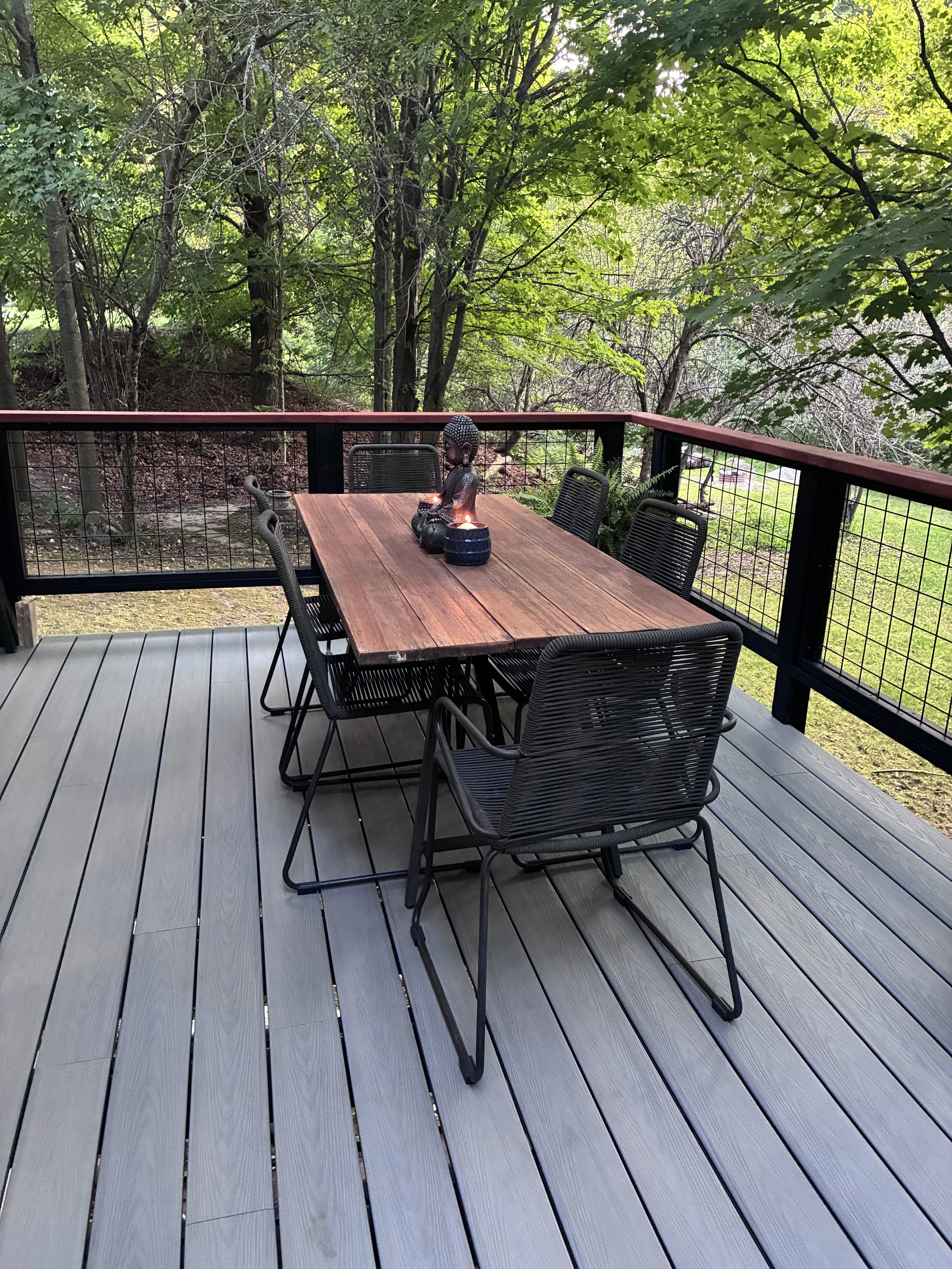 AFTER - fully re-decked with Trex along with custom rails with hog wire mesh grill. 