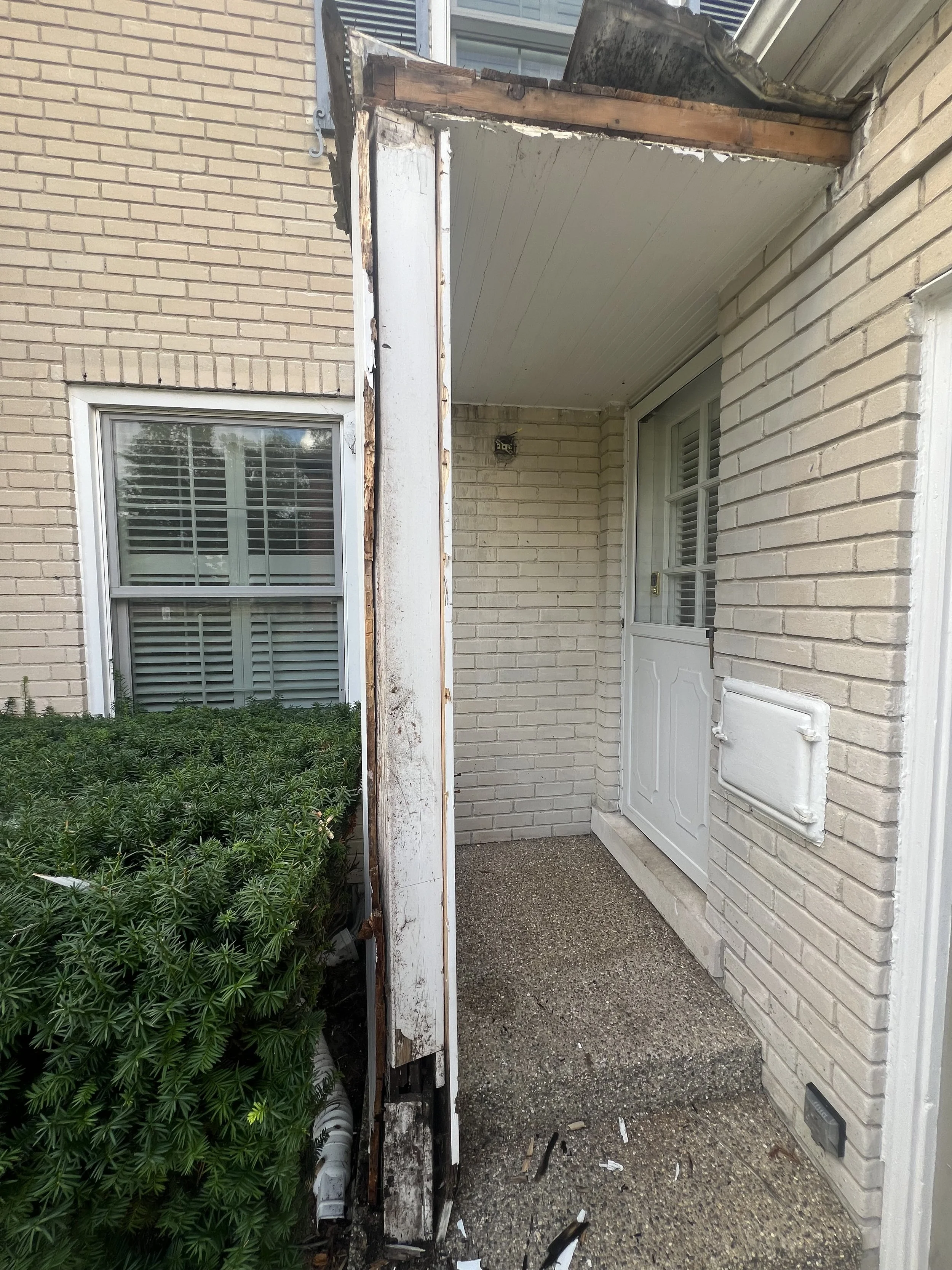 BEFORE - This portico on the side entrance of this home in GPP was rotted and infested with aunts. The entire structure was removed and the ledger boards replaced.