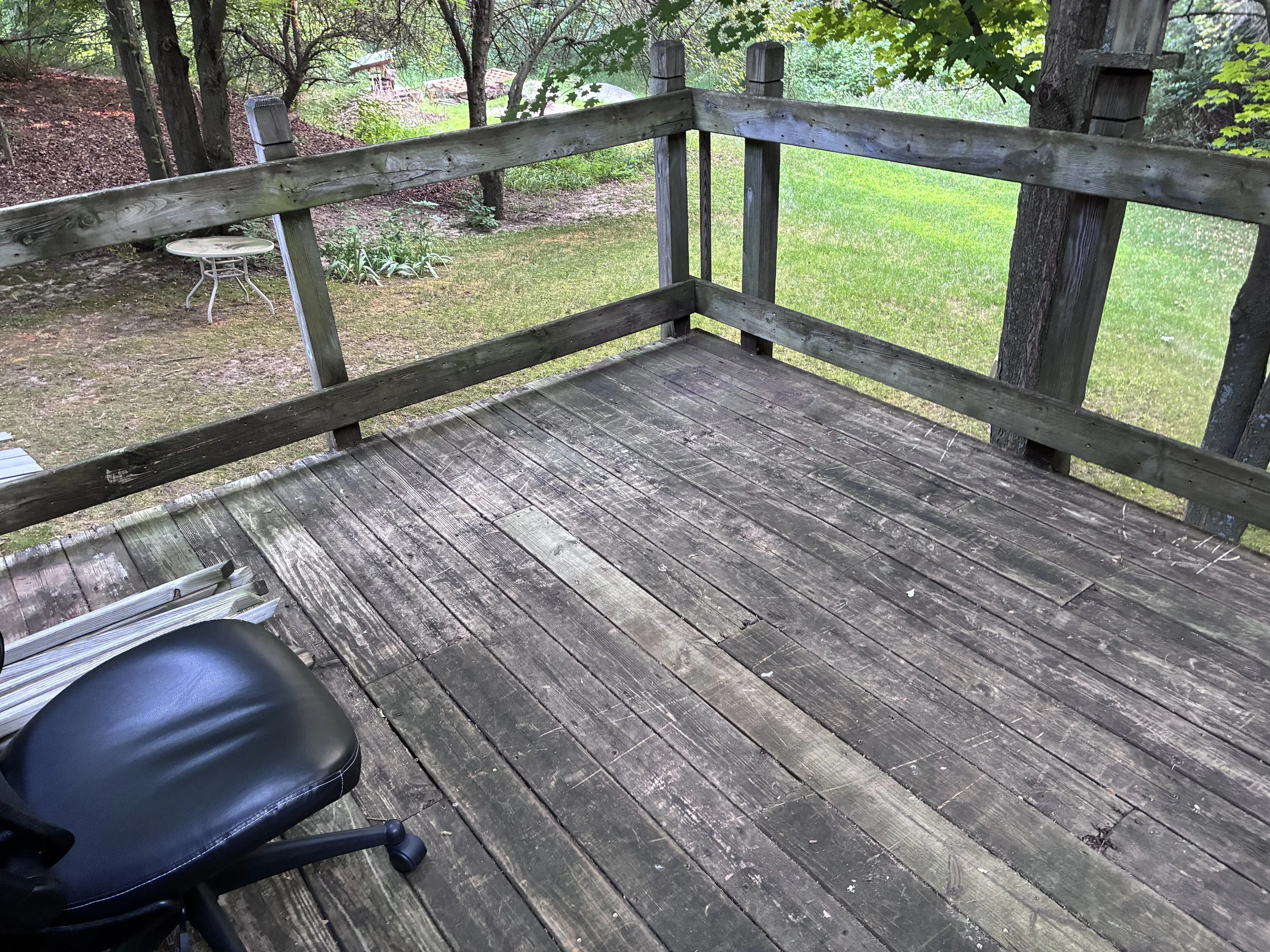 BEFORE - This raised deck was compromised  in several spots and prone to mildew and rot. It was an accident waiting to happen.