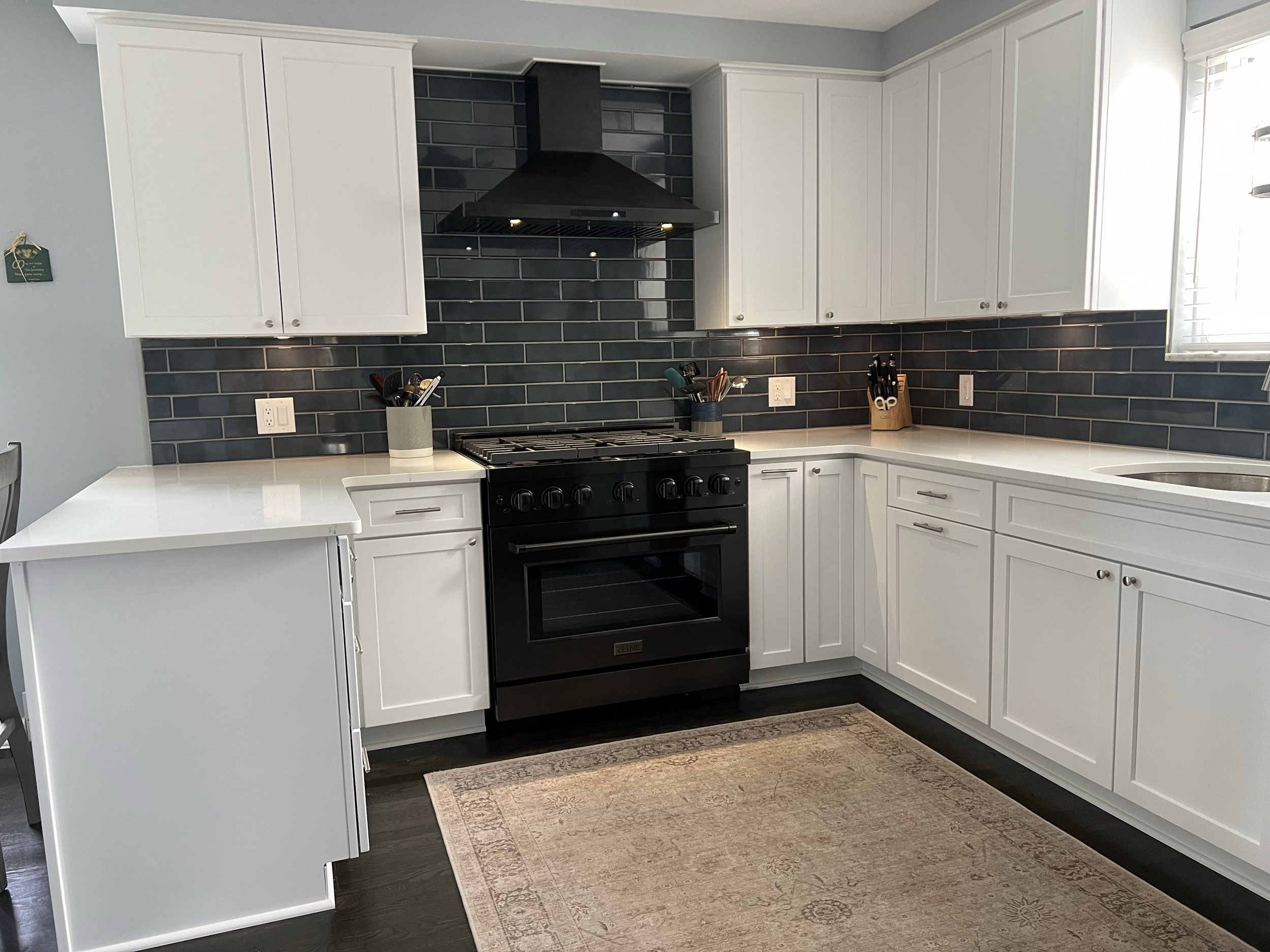AFTER - New Cabinets, counters, tile and lighting throughout