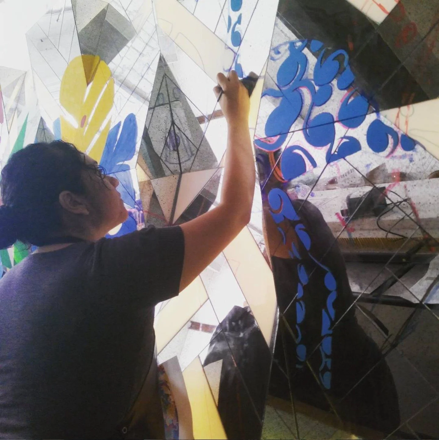 Back then, I helped to paint a mural in a restaurant. A friend invited me, and a group of us worked on it together.