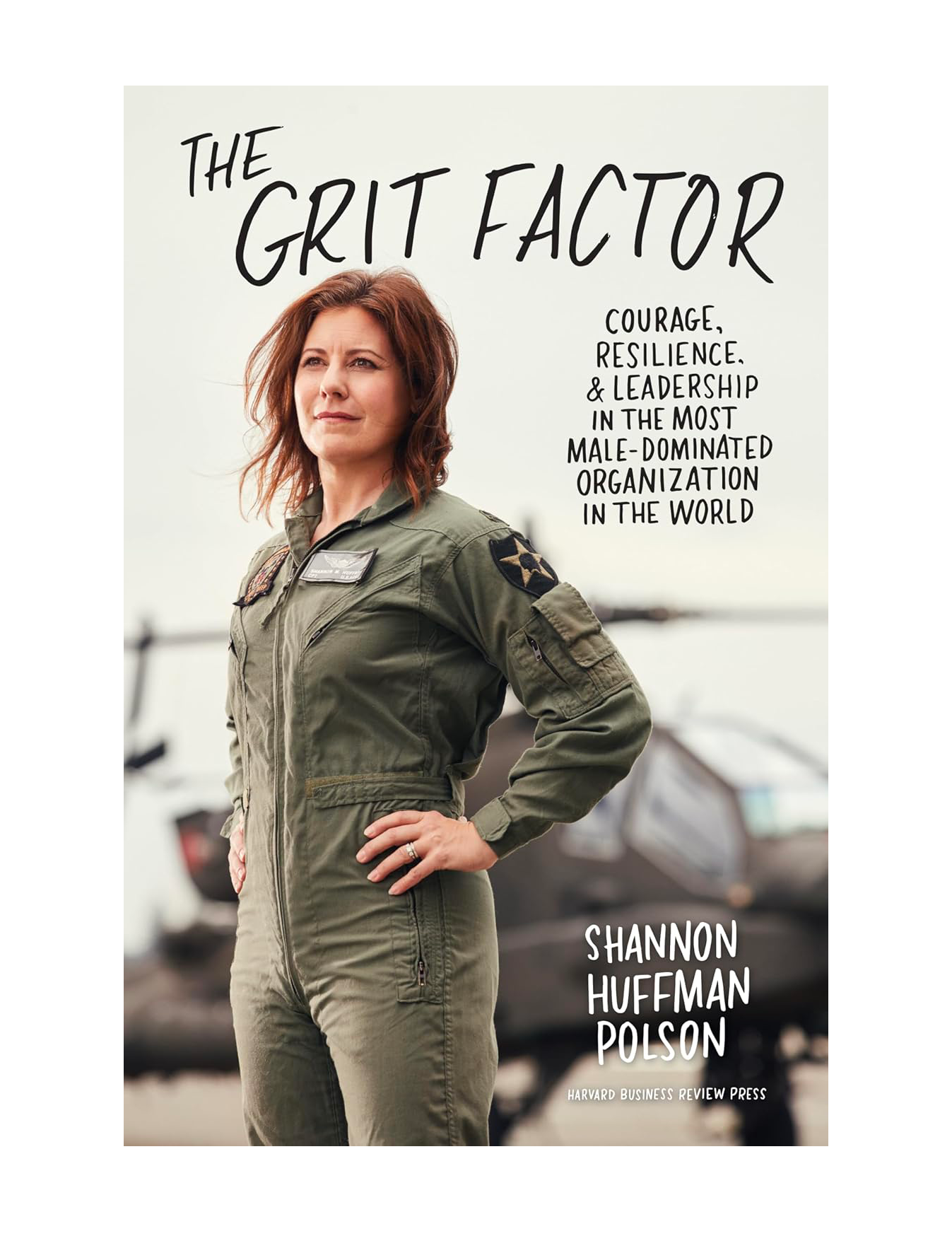 Cover of a book titled 'The Grit Factor' featuring a woman in a military flight suit with short brown hair, standing outdoors with an airplane in the background. The text on the cover emphasizes courage, resilience, leadership, and organization.