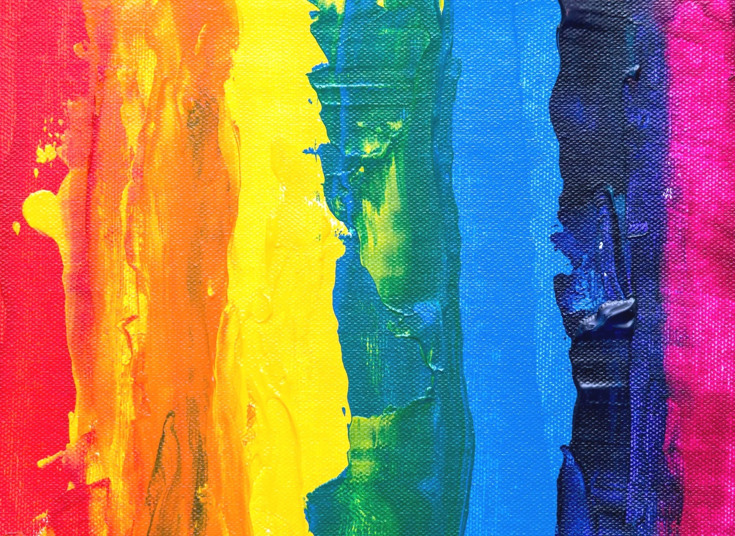 A canvas with imperfect rainbow-colored stripes on it
