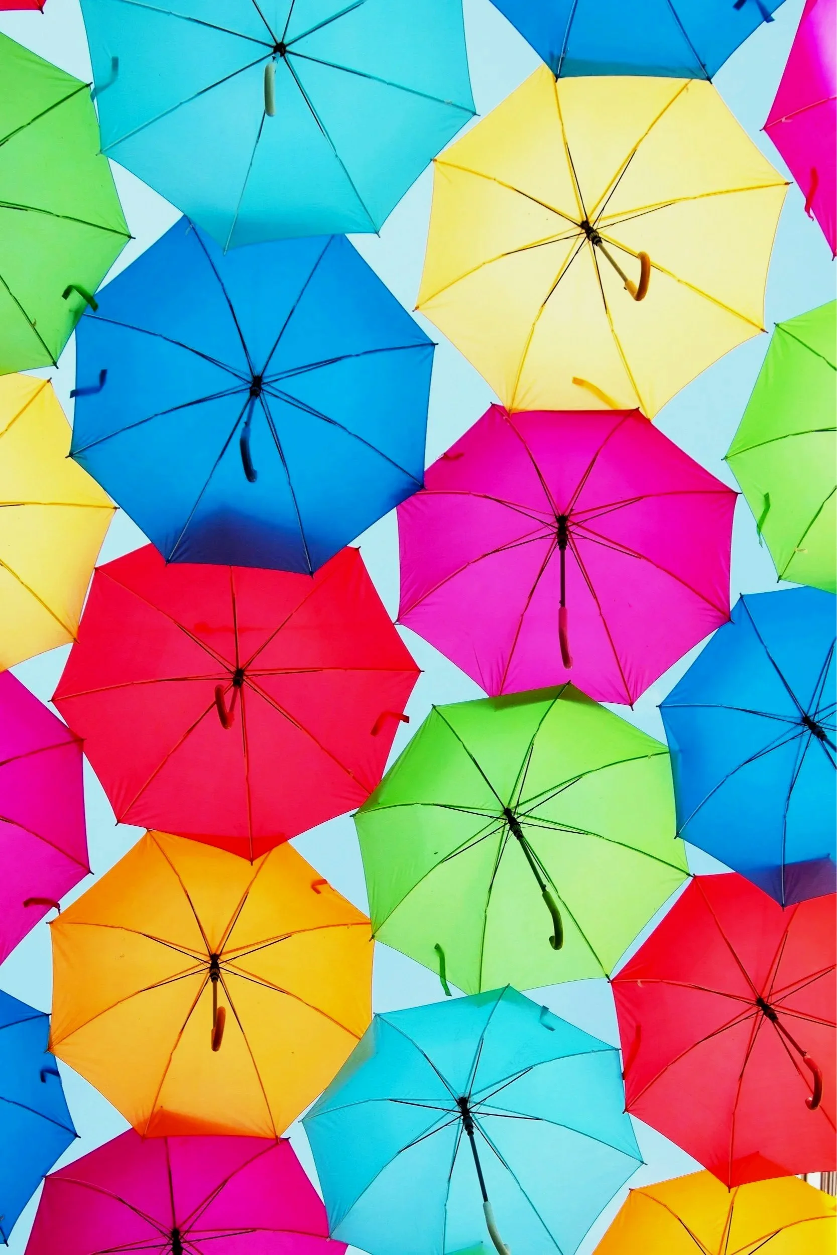 A sky filled with brightly colored umbrellas