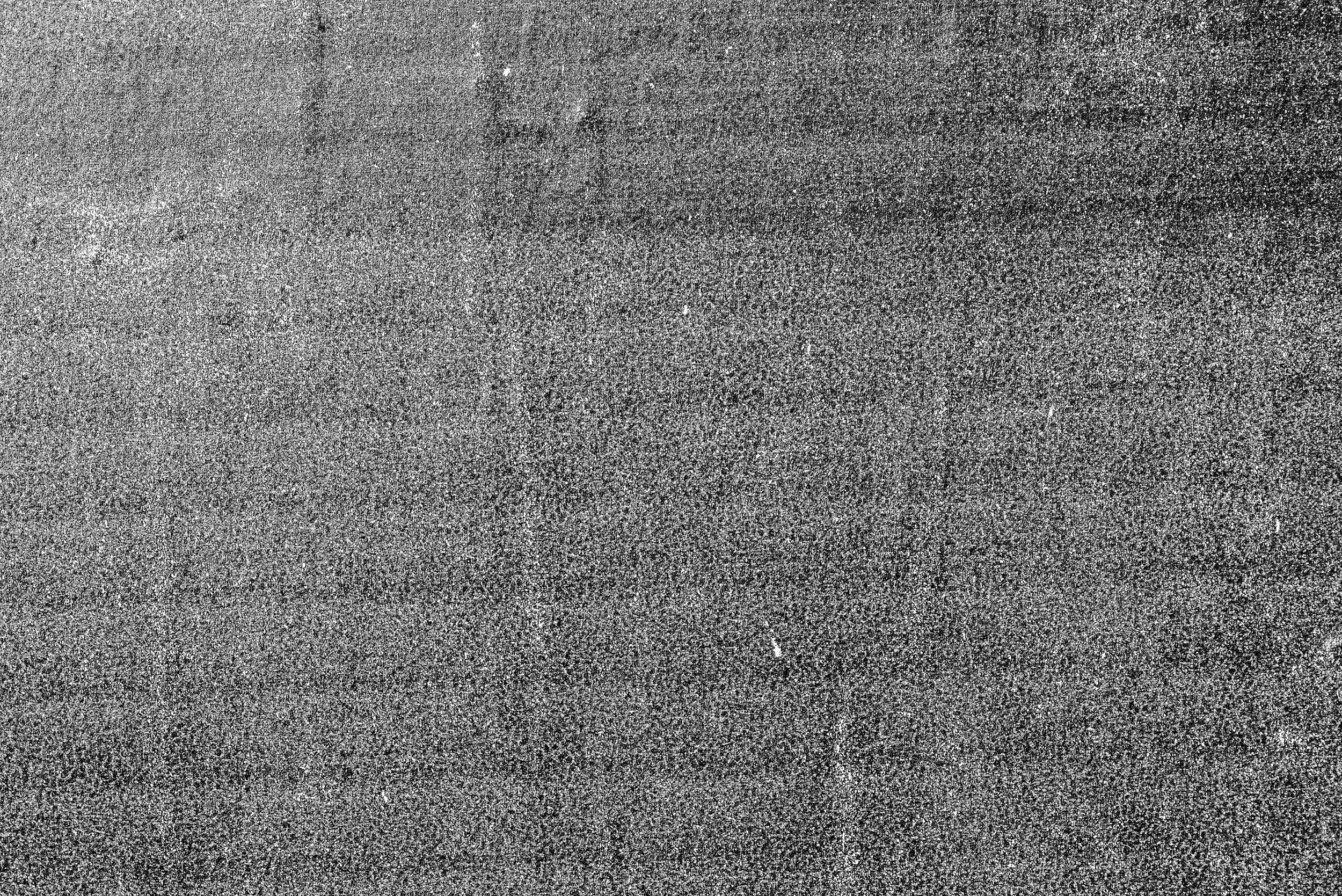 A background texture with grainy printed ink.