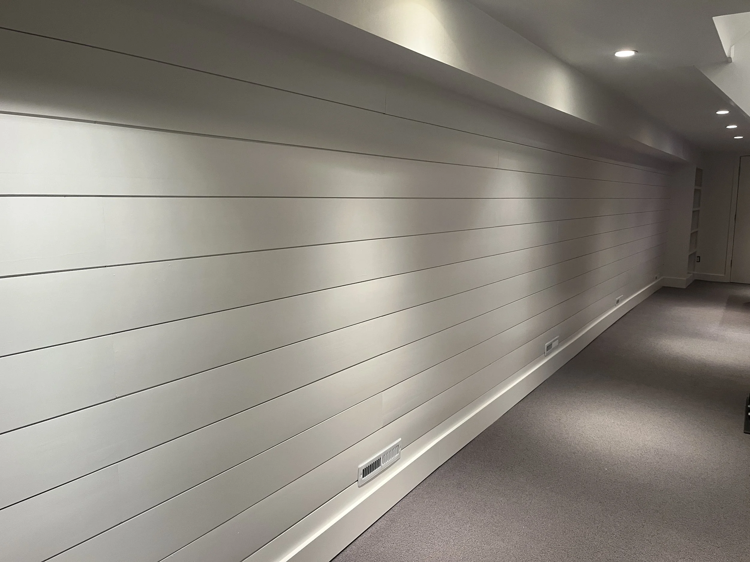 Basement Renovation with custom bookshelf