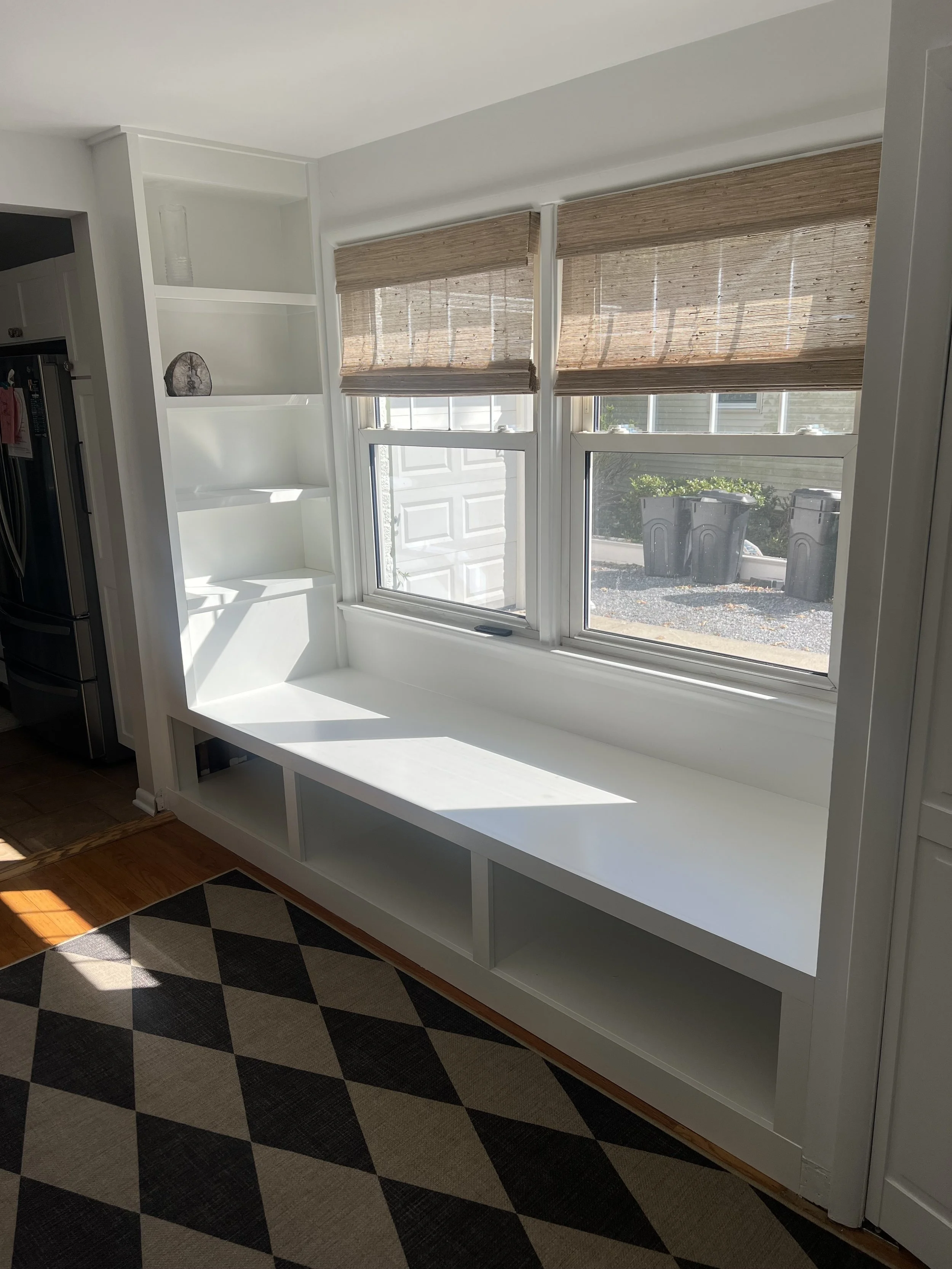 Custom built in window seat and bookshelf