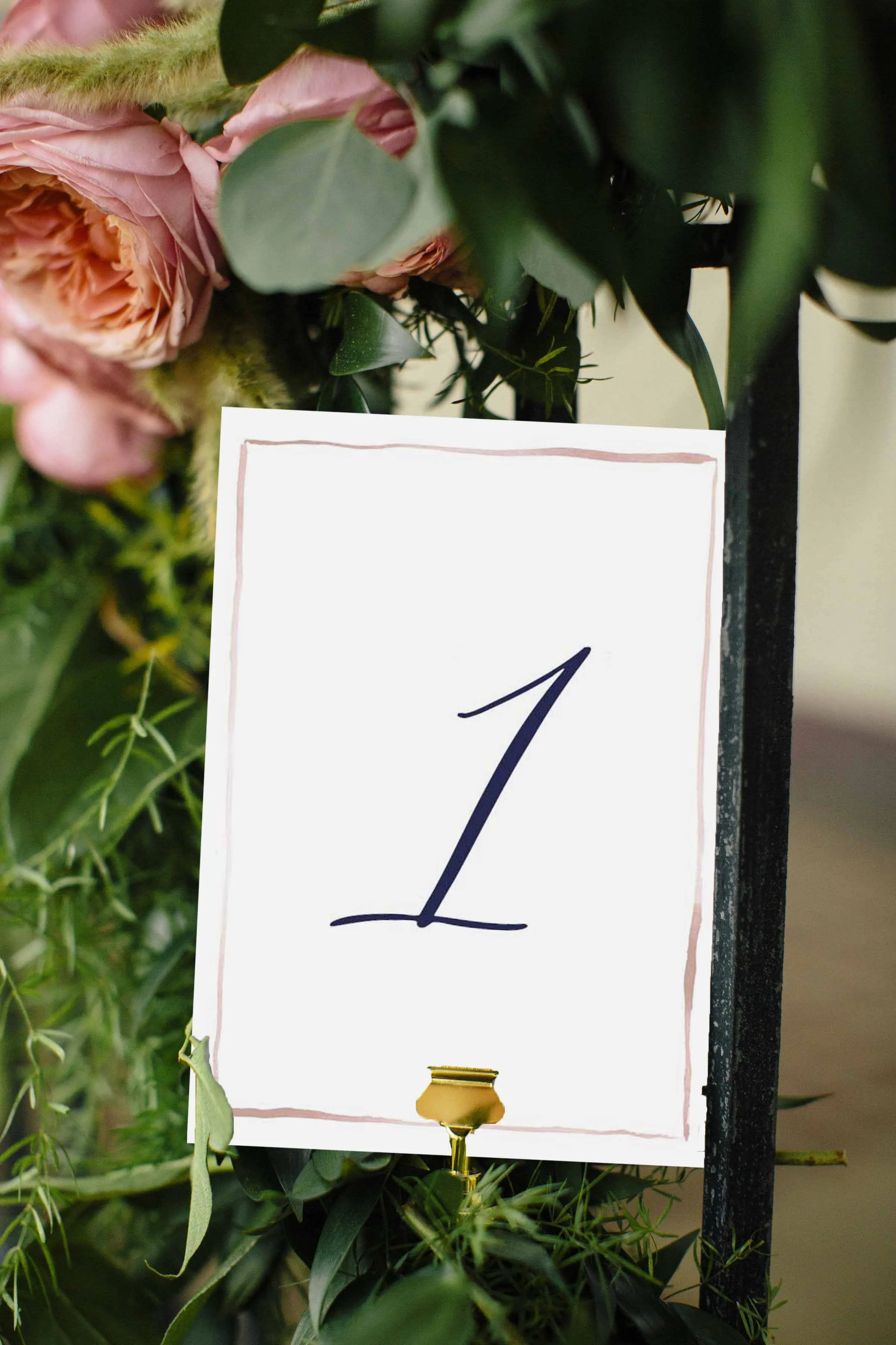 The colony in pink border table card photo.jpg